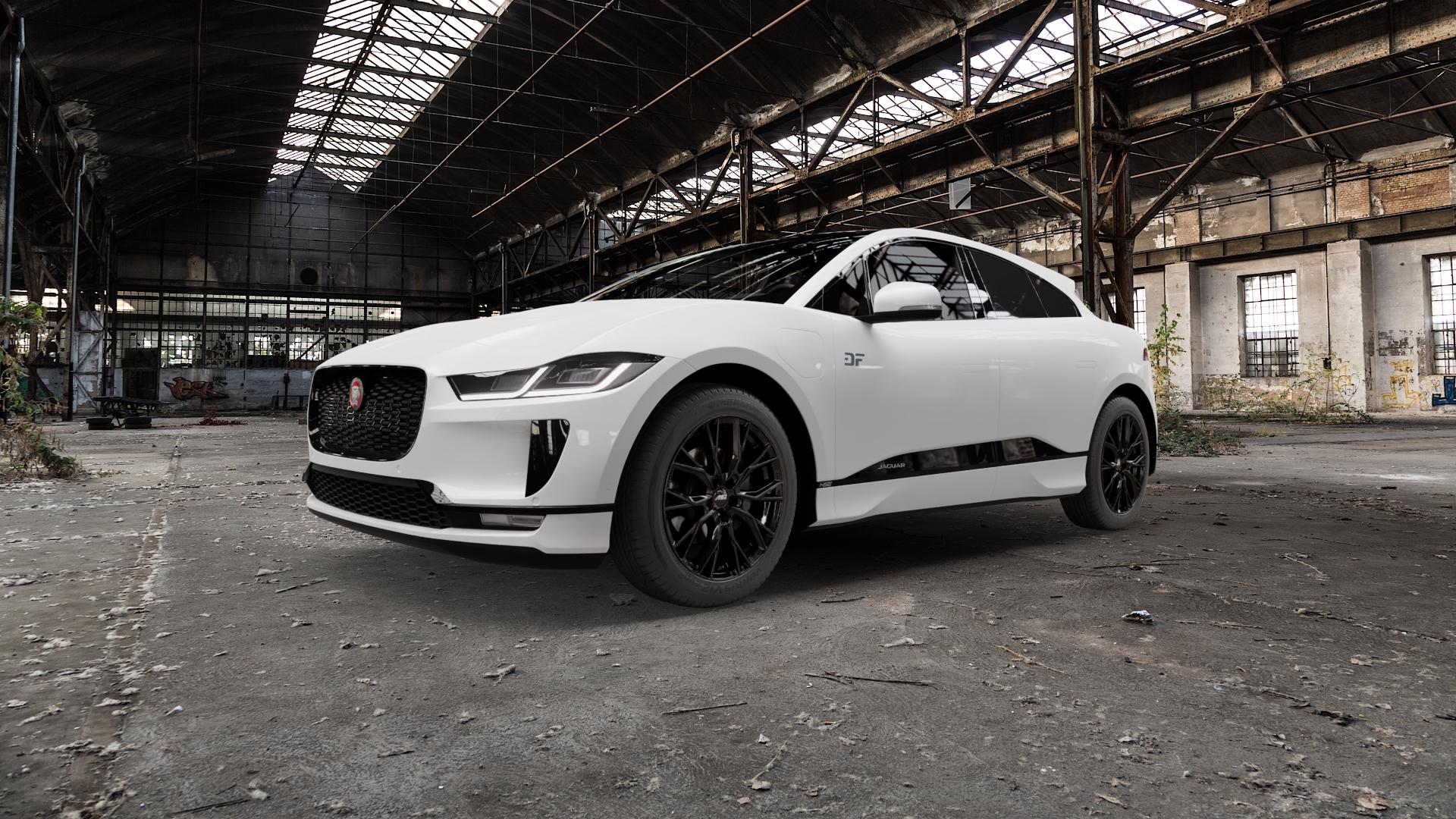 AEZ TORONTO BLACK Felge mit Reifen schwarz in 19Zoll Winterfelge Alufelge auf weissem Jaguar i-Pace ⬇️ mit 15mm Tieferlegung ⬇️ Old Industrial Hall_max5000mm_2022 Frontansicht_1