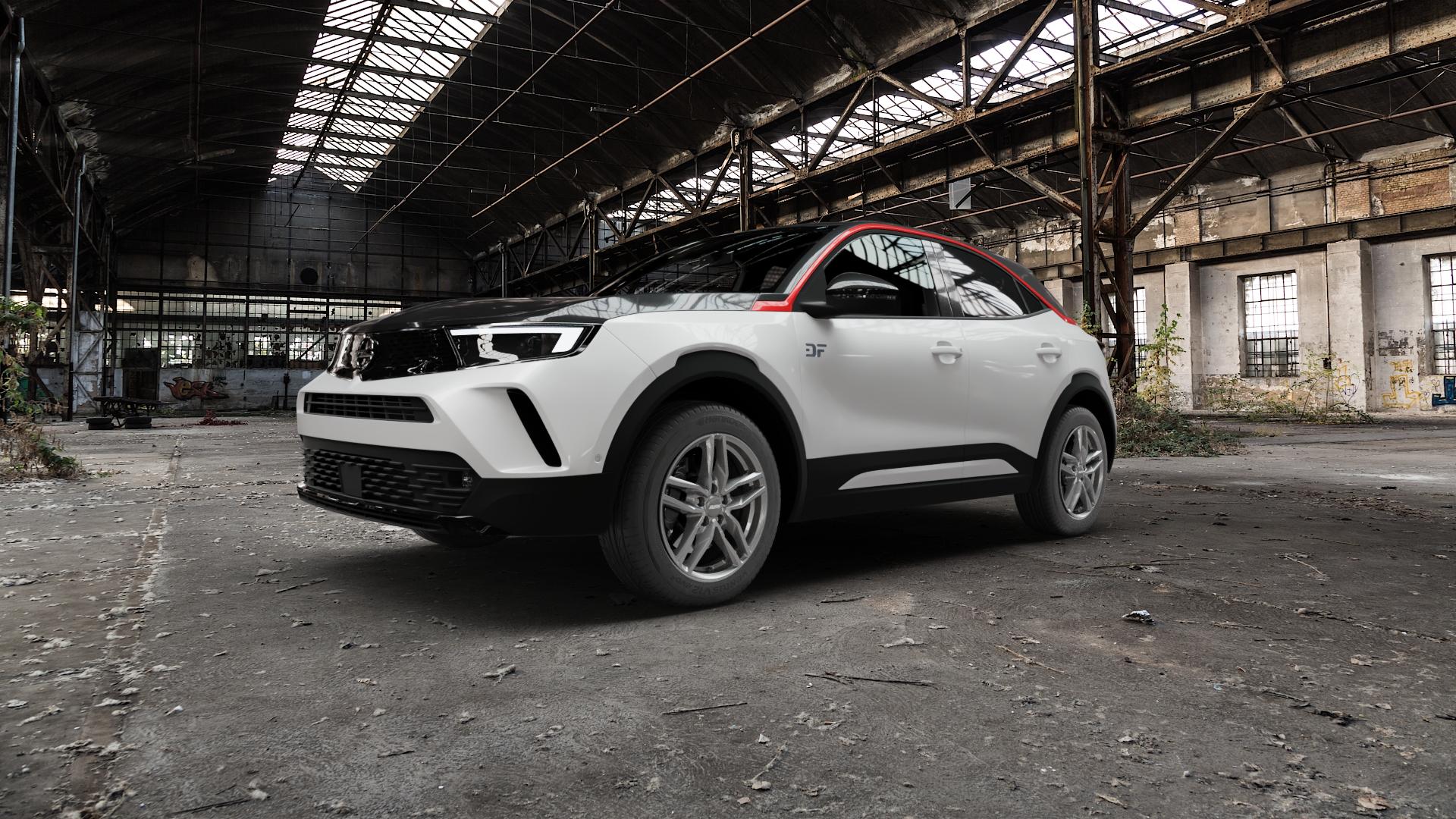 ALUTEC Ikenu metal-grey Felge mit Reifen grau in 17Zoll Winterfelge Alufelge auf weissem Opel Mokka-e Typ U 0,0l 57kW (77 PS) ⬇️ mit 15mm Tieferlegung ⬇️ Old Industrial Hall_max5000mm_2022 Frontansicht_1