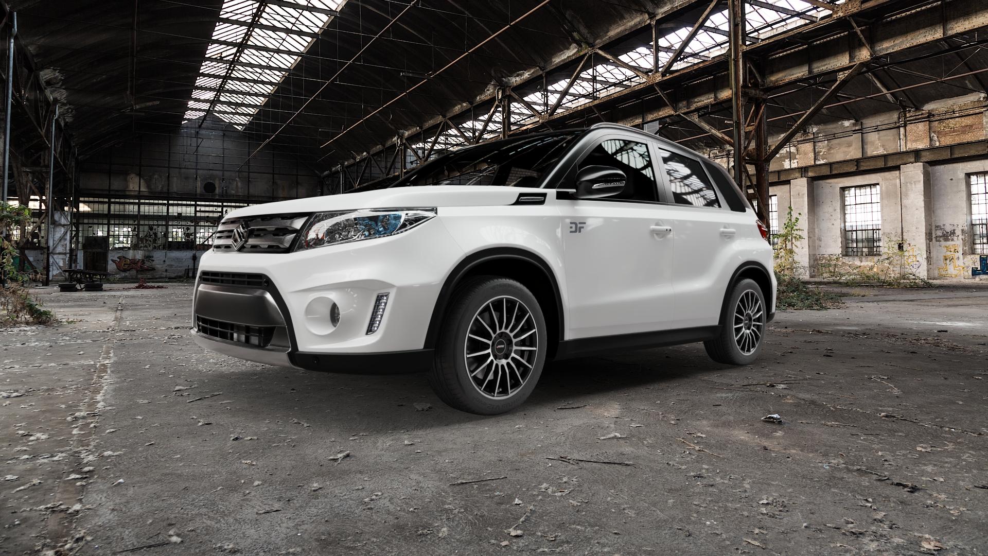 AUTEC Lamera Schwarz matt poliert Felge mit Reifen in 17Zoll Alufelge auf weissem Suzuki Vitara Typ LY 1,6l 88kW (120 PS) 4WD D ⬇️ mit 15mm Tieferlegung ⬇️ Old Industrial Hall_max5000mm_2022 Frontansicht_1