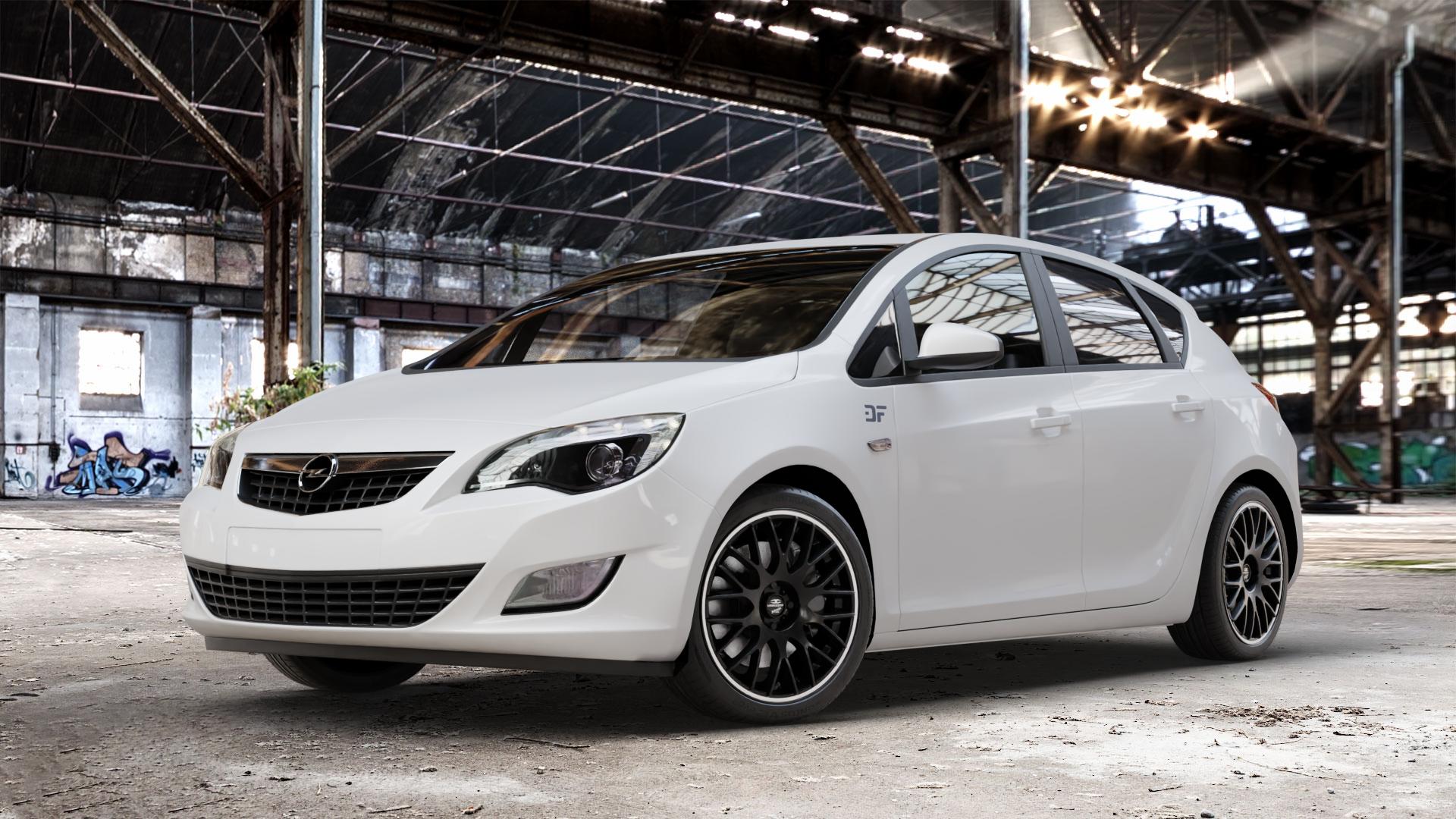 BARRACUDA Karizzma Mattblack Puresports / Color Trim weiss Felge mit Reifen schwarz farbige Outline mehrfarbig schwarz matt weiß in 18Zoll Winterfelge Alufelge auf weissem Opel Astra J Typ P-J Stufenheck ⬇️ mit 15mm Tieferlegung ⬇️ Old Industrial Hall_max_4400mm_2024 Frontansicht_1
