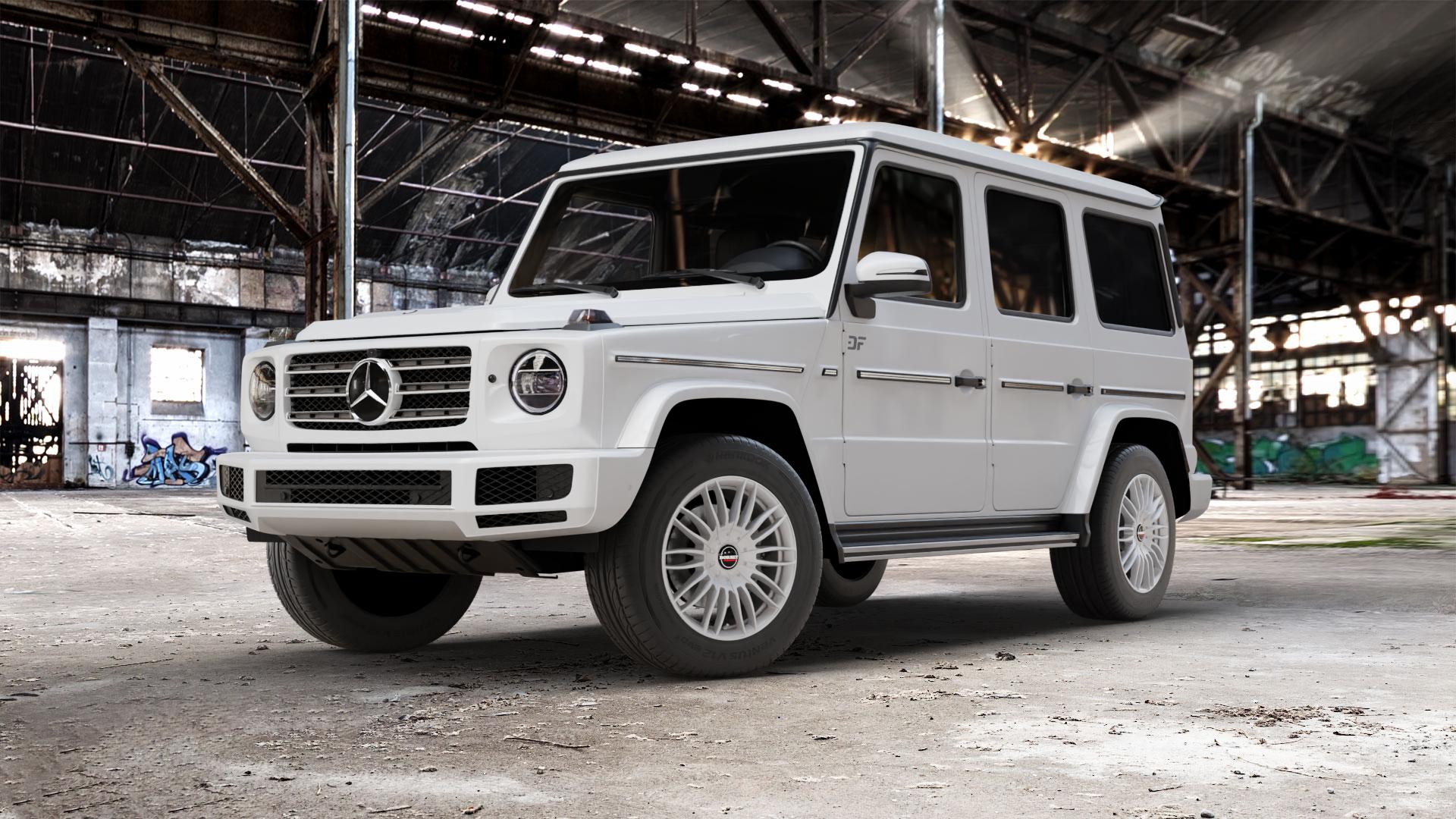 Borbet CW3 black glossy Felge mit Reifen schwarz in 18Zoll Winterfelge Alufelge auf weissem Mercedes G-Klasse Typ W463 Facelift (18->) ⬇️ mit 15mm Tieferlegung ⬇️ Old Industrial Hall_max_5300mm_2024 Frontansicht_1