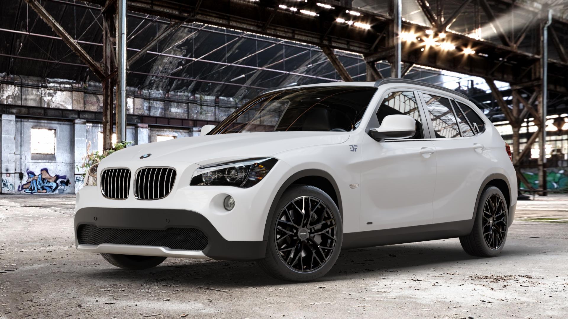 CARMANI 20 Ludwig black Felge mit Reifen schwarz in 18Zoll Winterfelge Alufelge auf weissem BMW X1 Typ E84 (X1, X-N1, X1-N1) ⬇️ mit 15mm Tieferlegung ⬇️ Old Industrial Hall_max_4400mm_2024 Frontansicht_1