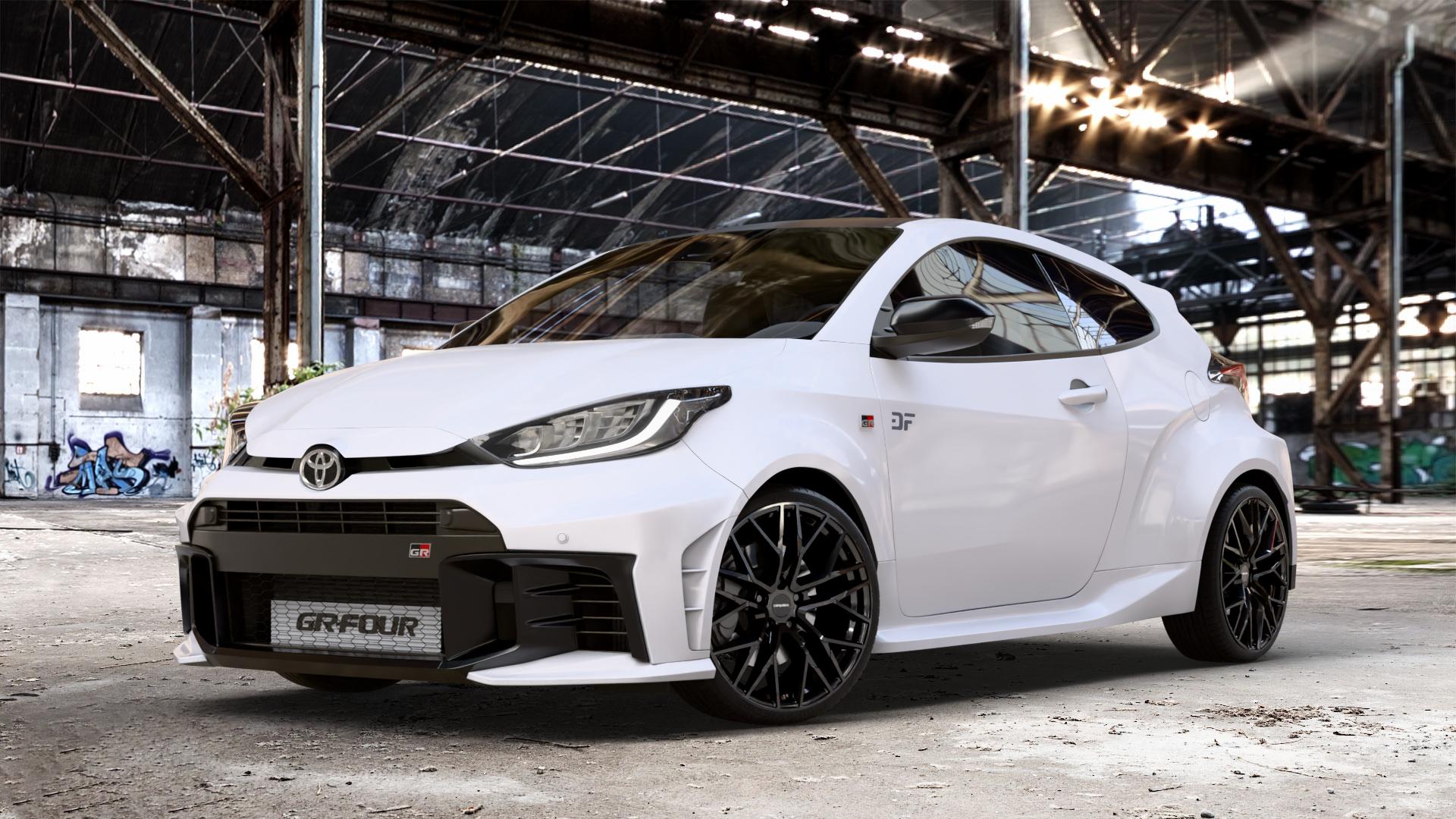 CARMANI 20 Ludwig black Felge mit Reifen schwarz in 19Zoll Winterfelge Alufelge auf weissem Toyota Yaris IV GR Typ XPA1G(EU,M) Facelift ⬇️ mit 15mm Tieferlegung ⬇️ Old Industrial Hall_max_4400mm_2024 Frontansicht_1