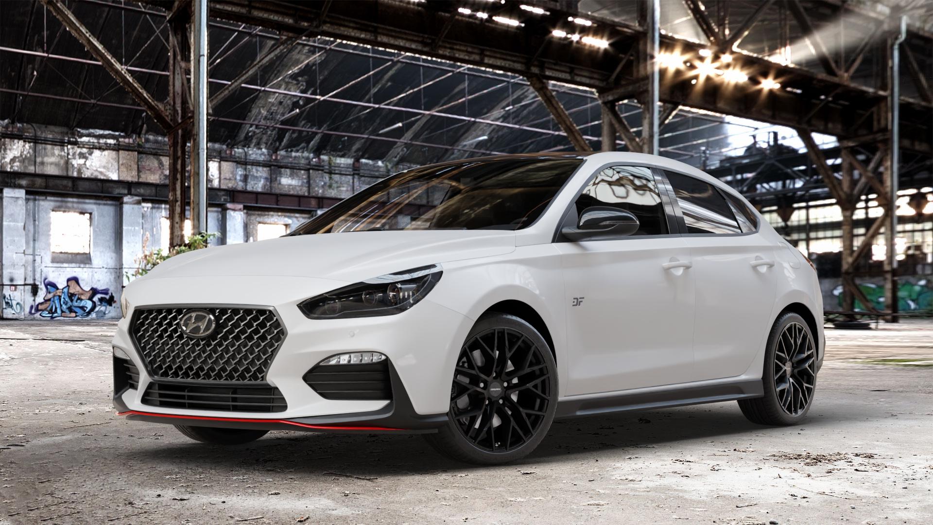 CARMANI 20 Ludwig black matt Felge mit Reifen schwarz in 18Zoll Winterfelge Alufelge auf weissem Hyundai i30 Typ PDE Fastback ⬇️ mit 15mm Tieferlegung ⬇️ Old Industrial Hall_max_4400mm_2024 Frontansicht_1