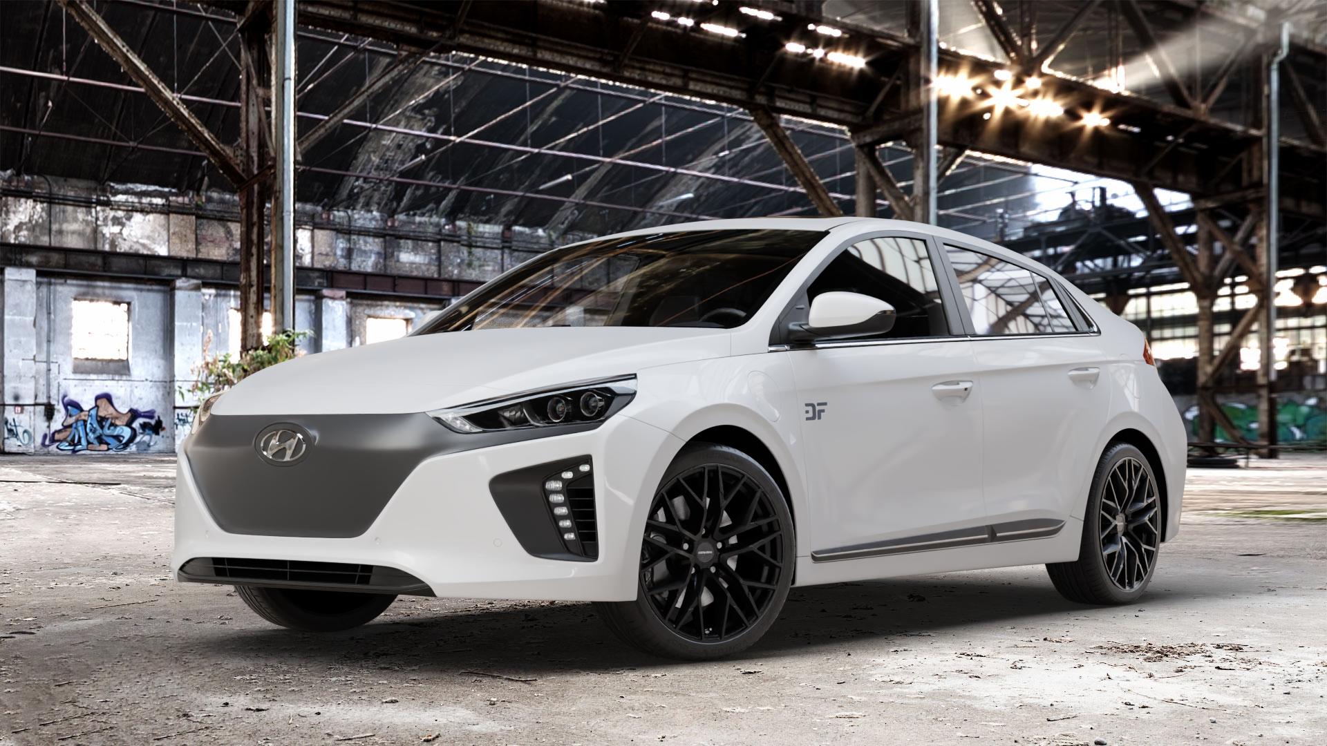 CARMANI 20 Ludwig black matt Felge mit Reifen schwarz in 18Zoll Winterfelge Alufelge auf weissem Hyundai Ioniq Typ AE ⬇️ mit 15mm Tieferlegung ⬇️ Old Industrial Hall_max_4400mm_2024 Frontansicht_1