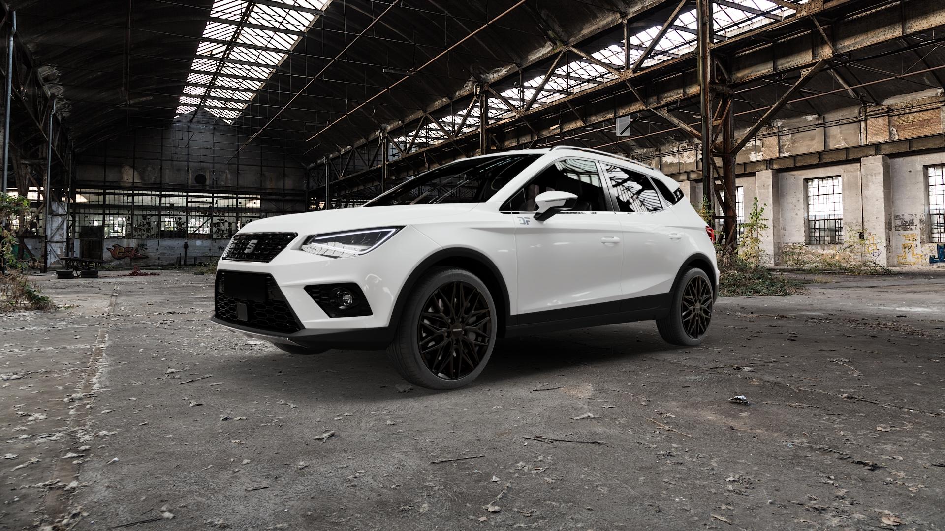 CARMANI 26 Max black Felge mit Reifen schwarz in 18Zoll Winterfelge Alufelge auf weissem Seat Arona Typ KJ ⬇️ mit 15mm Tieferlegung ⬇️ Old Industrial Hall_max5000mm_2022 Frontansicht_1