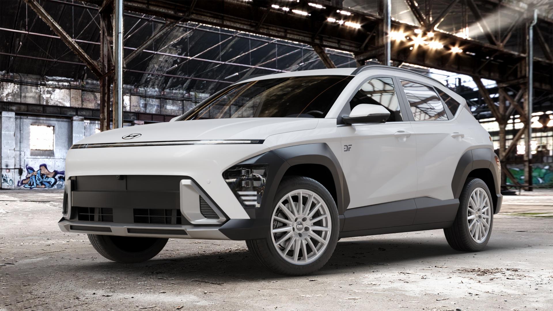 CMS C23 Racing Silver Felge mit Reifen silber in 18Zoll Winterfelge Alufelge auf weissem Hyundai Kona Typ SX2 ⬇️ mit 15mm Tieferlegung ⬇️ Old Industrial Hall_max_4400mm_2024 Frontansicht_1