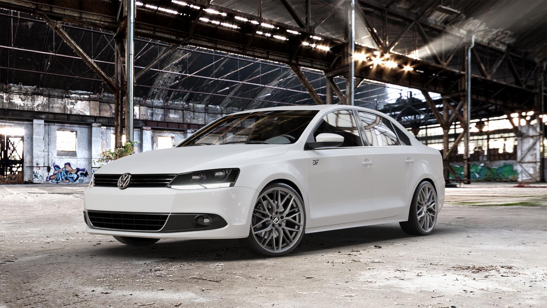 Damina Performance DM08 Anthrazit Felge mit Reifen grau in 19Zoll Winterfelge Alufelge auf weissem Volkswagen (VW) Jetta 6 Typ 16 Facelift ⬇️ mit 15mm Tieferlegung ⬇️ Old Industrial Hall_max_5300mm_2024 Frontansicht_1