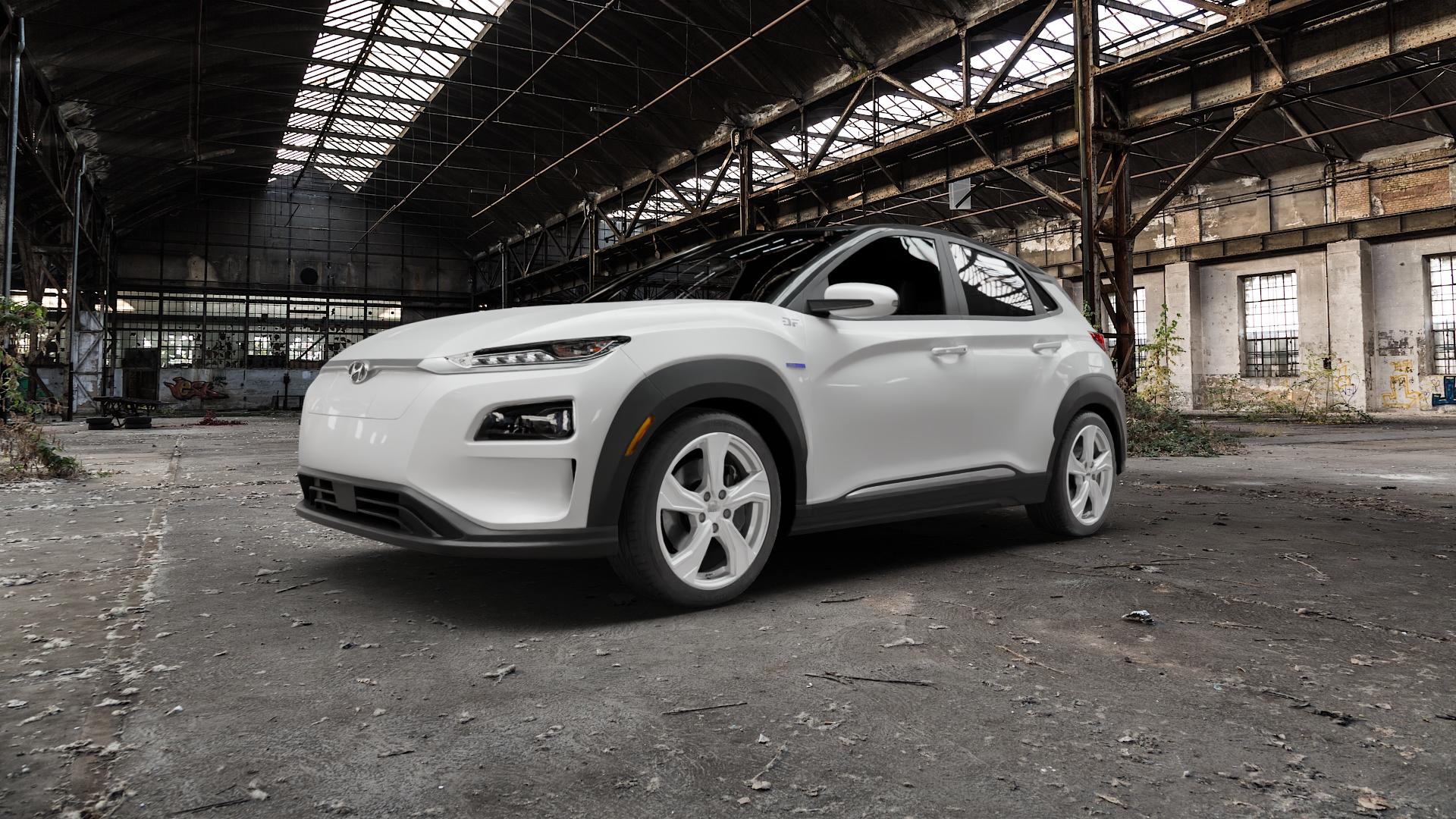 DEZENT KB SILVER Felge mit Reifen silber schwarz in 18Zoll Winterfelge Alufelge auf weissem Hyundai Kona Elektro Typ OS ⬇️ mit 15mm Tieferlegung ⬇️ Old Industrial Hall_max5000mm_2022 Frontansicht_1