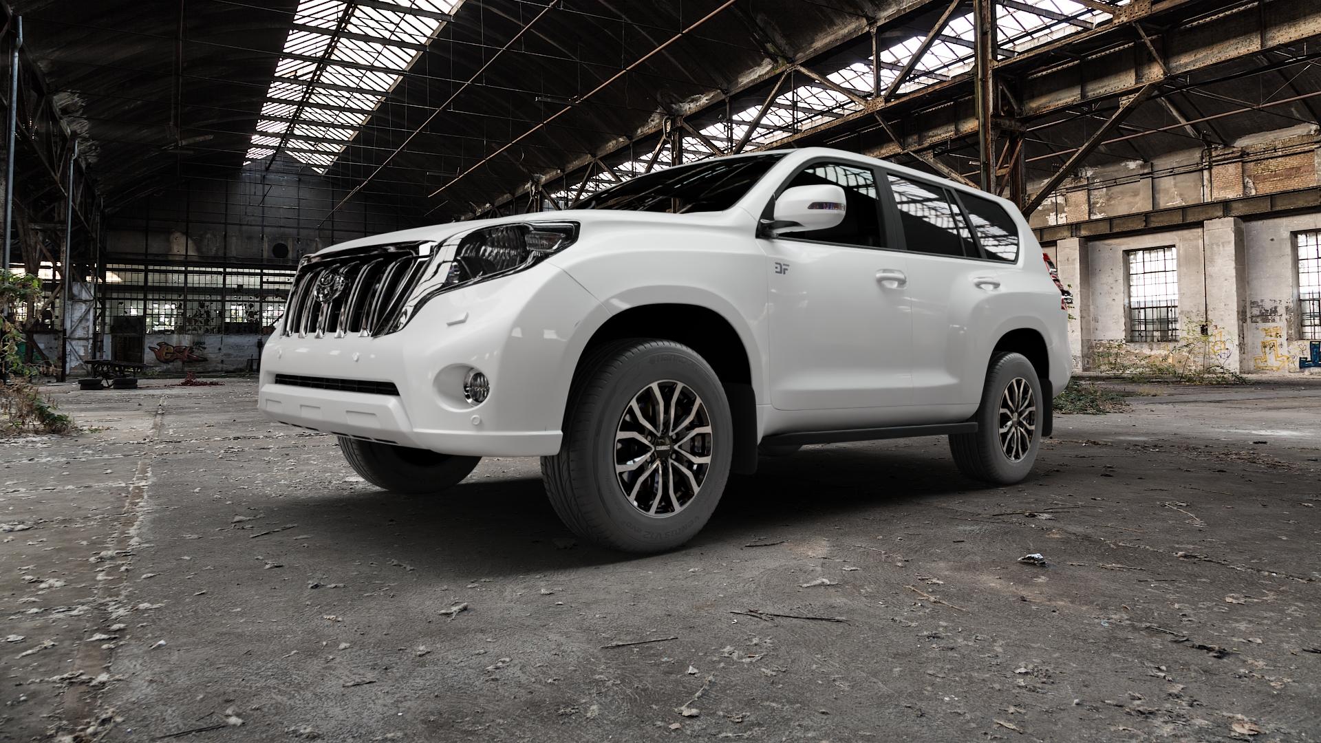 DEZENT KC BLACK/POLISHED Felge mit Reifen schwarz in 17Zoll Winterfelge Alufelge auf weissem Toyota Land Cruiser Typ J15TM Facelift 14-> ⬇️ mit 15mm Tieferlegung ⬇️ Old Industrial Hall_max5000mm_2022 Frontansicht_1