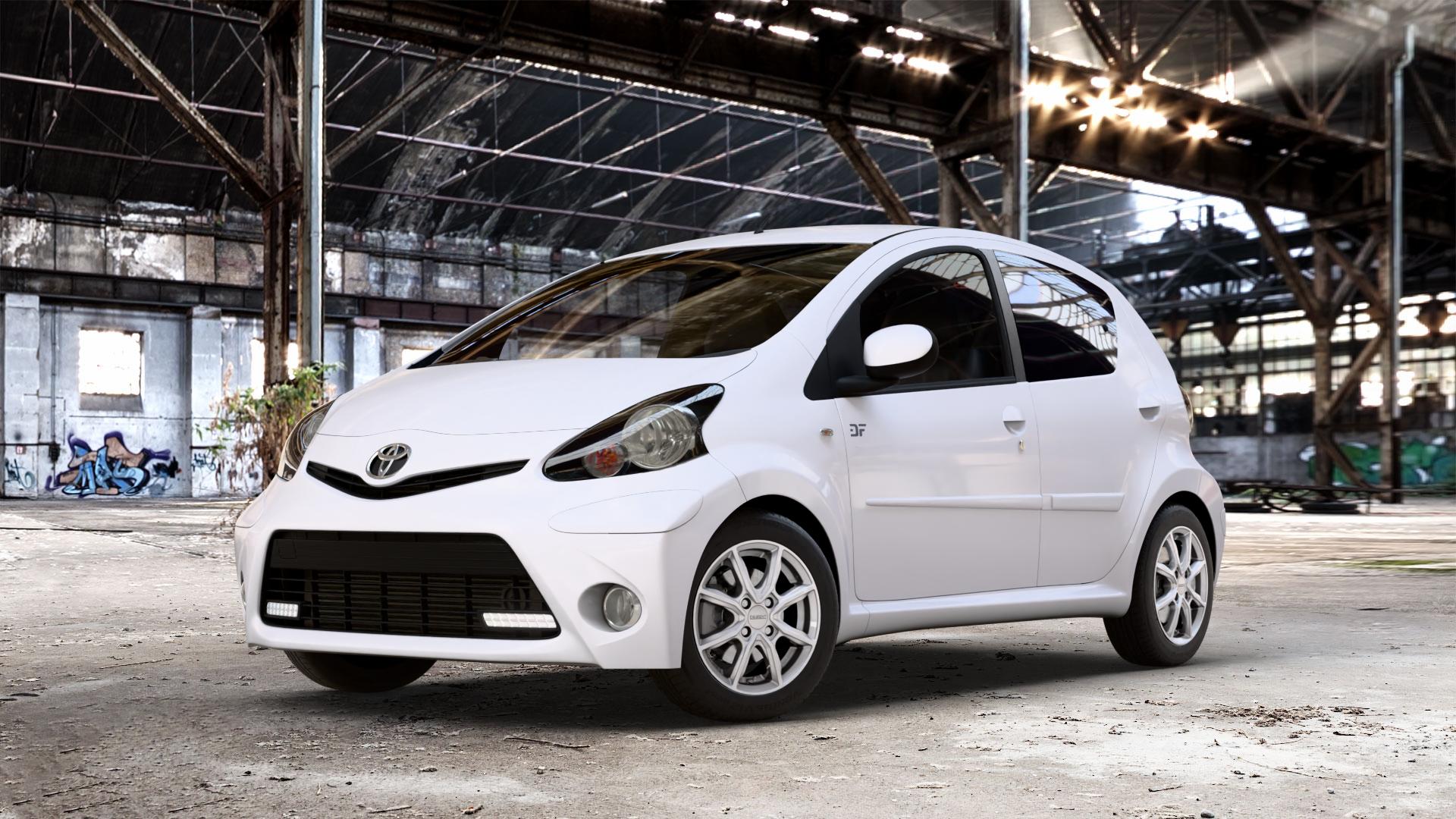 DEZENT TN SILVER Felge mit Reifen silber in 14Zoll Winterfelge Alufelge auf weissem Toyota Aygo I ⬇️ mit 15mm Tieferlegung ⬇️ Old Industrial Hall_max_4400mm_2024 Frontansicht_1