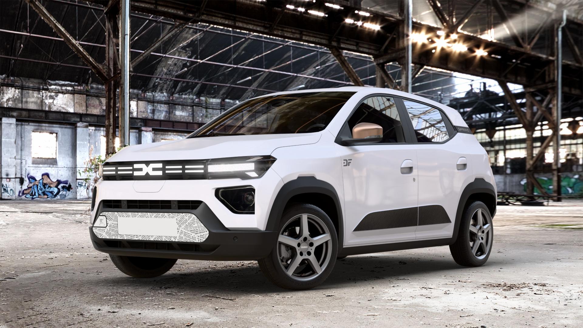 DEZENT TY GRAPHITE MATT Felge mit Reifen grau anthrazit in 15Zoll Winterfelge Alufelge auf weissem Dacia Spring ⬇️ mit 15mm Tieferlegung ⬇️ Old Industrial Hall_max_4400mm_2024 Frontansicht_1