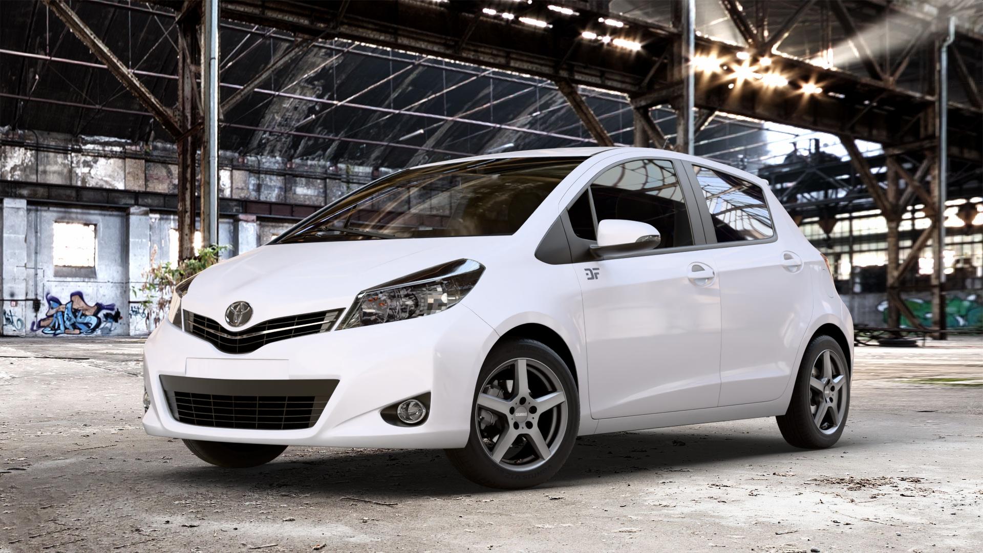 DEZENT TY GRAPHITE MATT Felge mit Reifen grau anthrazit in 15Zoll Winterfelge Alufelge auf weissem Toyota Yaris III Typ XP13 Facelift 17-> ⬇️ mit 15mm Tieferlegung ⬇️ Old Industrial Hall_max_4400mm_2024 Frontansicht_1