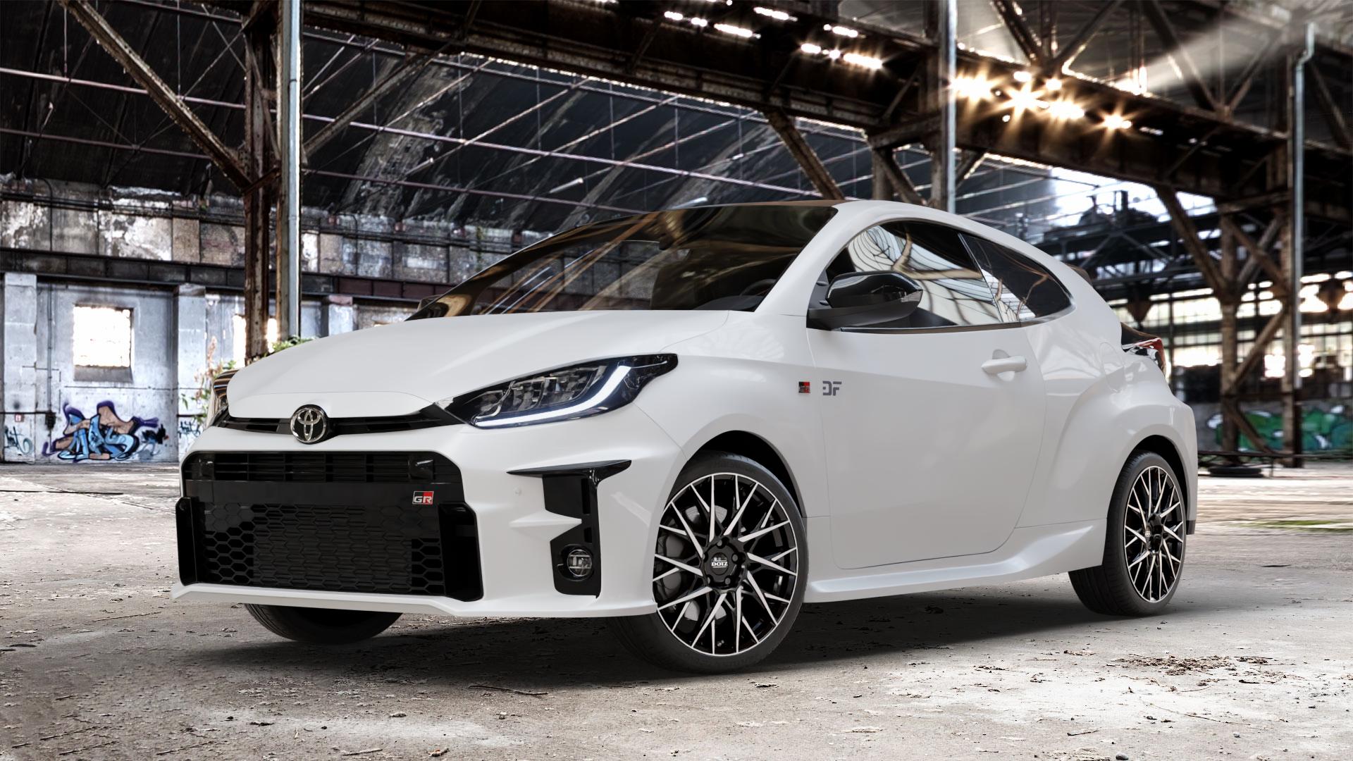 DOTZ FUJI BLACK/POLISHED Felge mit Reifen silber schwarz mehrfarbig in 18Zoll Winterfelge Alufelge auf weissem Toyota Yaris IV Typ XPA1F(EU,M) l kW (0 PS) GR XPA1G(EU,M) ⬇️ mit 15mm Tieferlegung ⬇️ Old Industrial Hall_max_4400mm_2024 Frontansicht_1