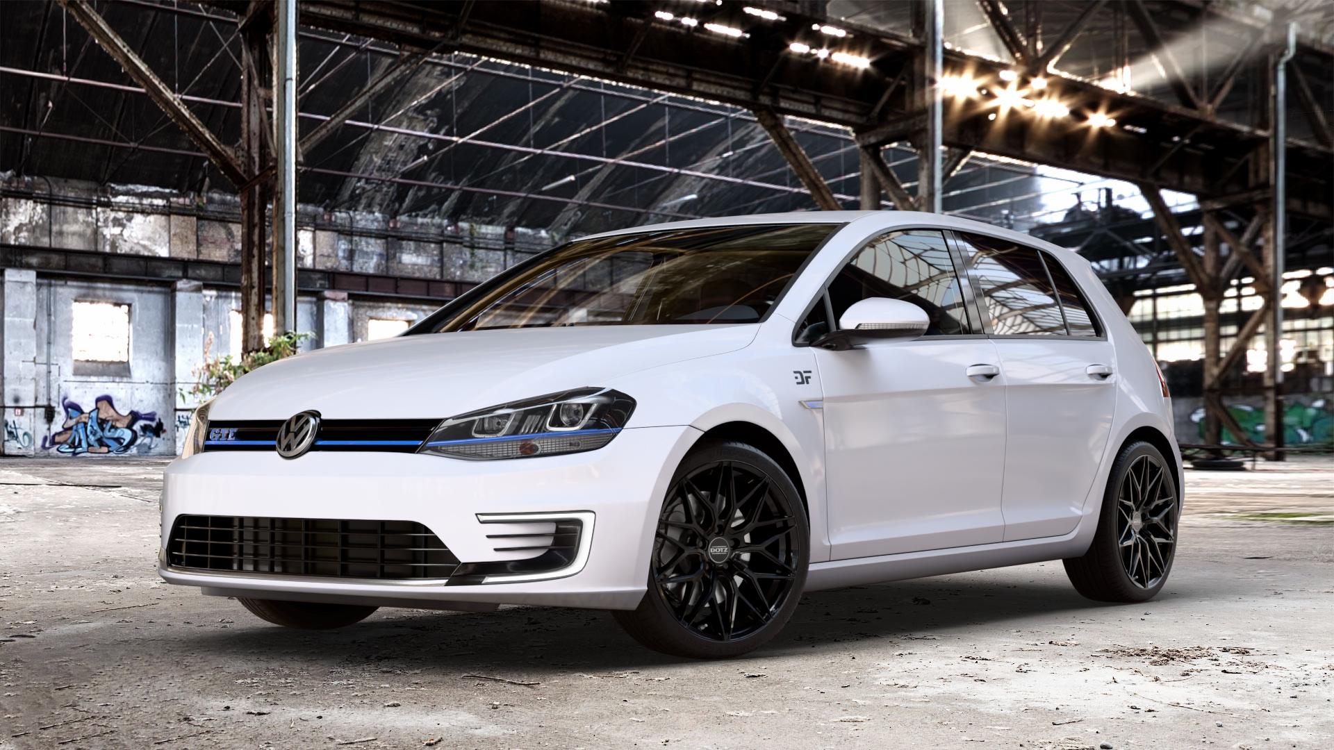 DOTZ SUZUKA BLACK Felge mit Reifen schwarz in 18Zoll Winterfelge Alufelge auf weissem Volkswagen (VW) Golf 7 1,4l GTE Hybrid 110kW (150 PS) Facelift 0,0l e-Golf 100kW (136 ⬇️ mit 15mm Tieferlegung ⬇️ Old Industrial Hall_max_4400mm_2024 Frontansicht_1
