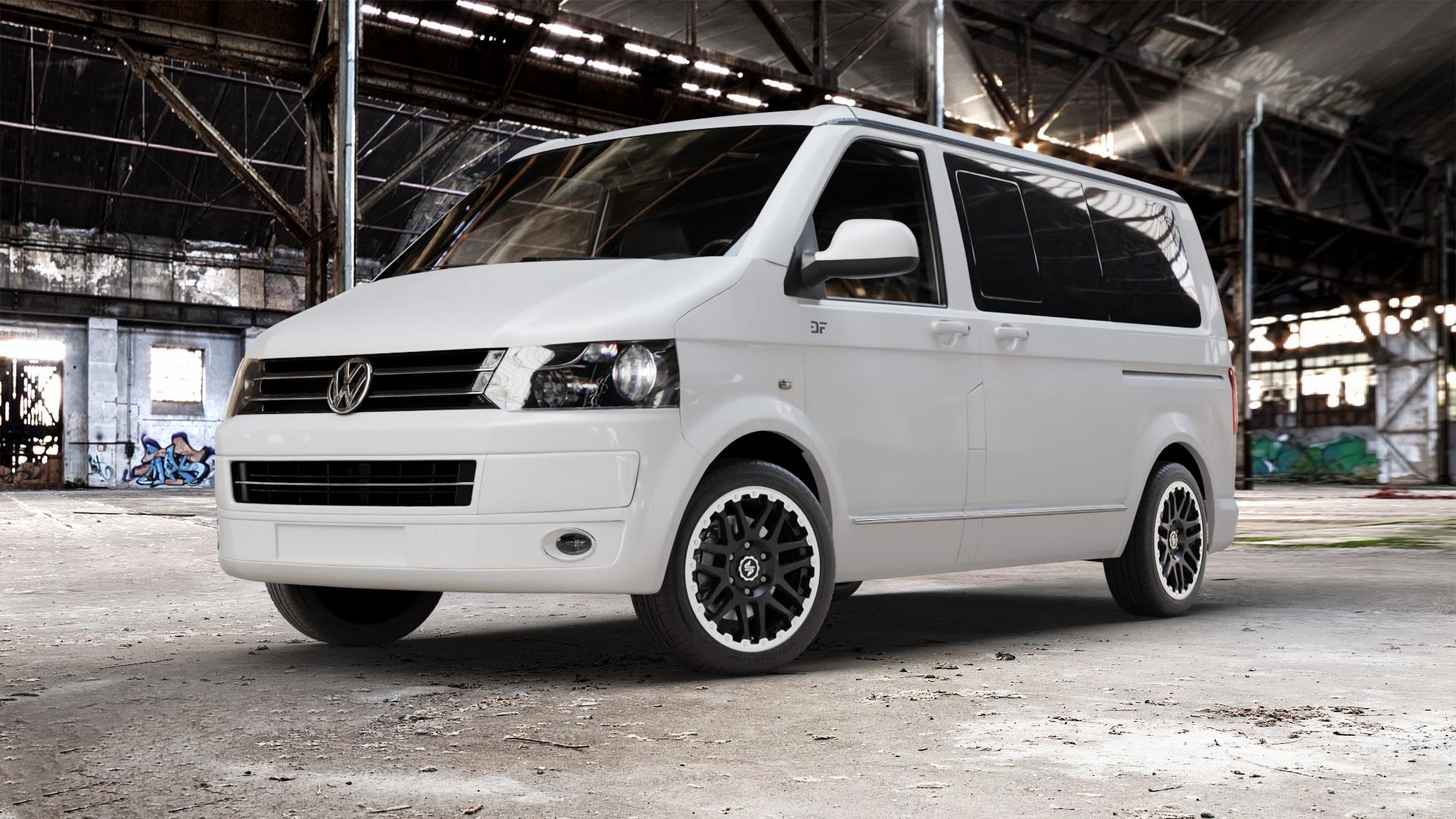 etabeta COMBAT CV Black matt lip + cap pol. Felge mit Reifen schwarz in 18Zoll Alufelge auf weissem Volkswagen (VW) T5 California ⬇️ mit 15mm Tieferlegung ⬇️ Old Industrial Hall_max_5300mm_2024 Frontansicht_1