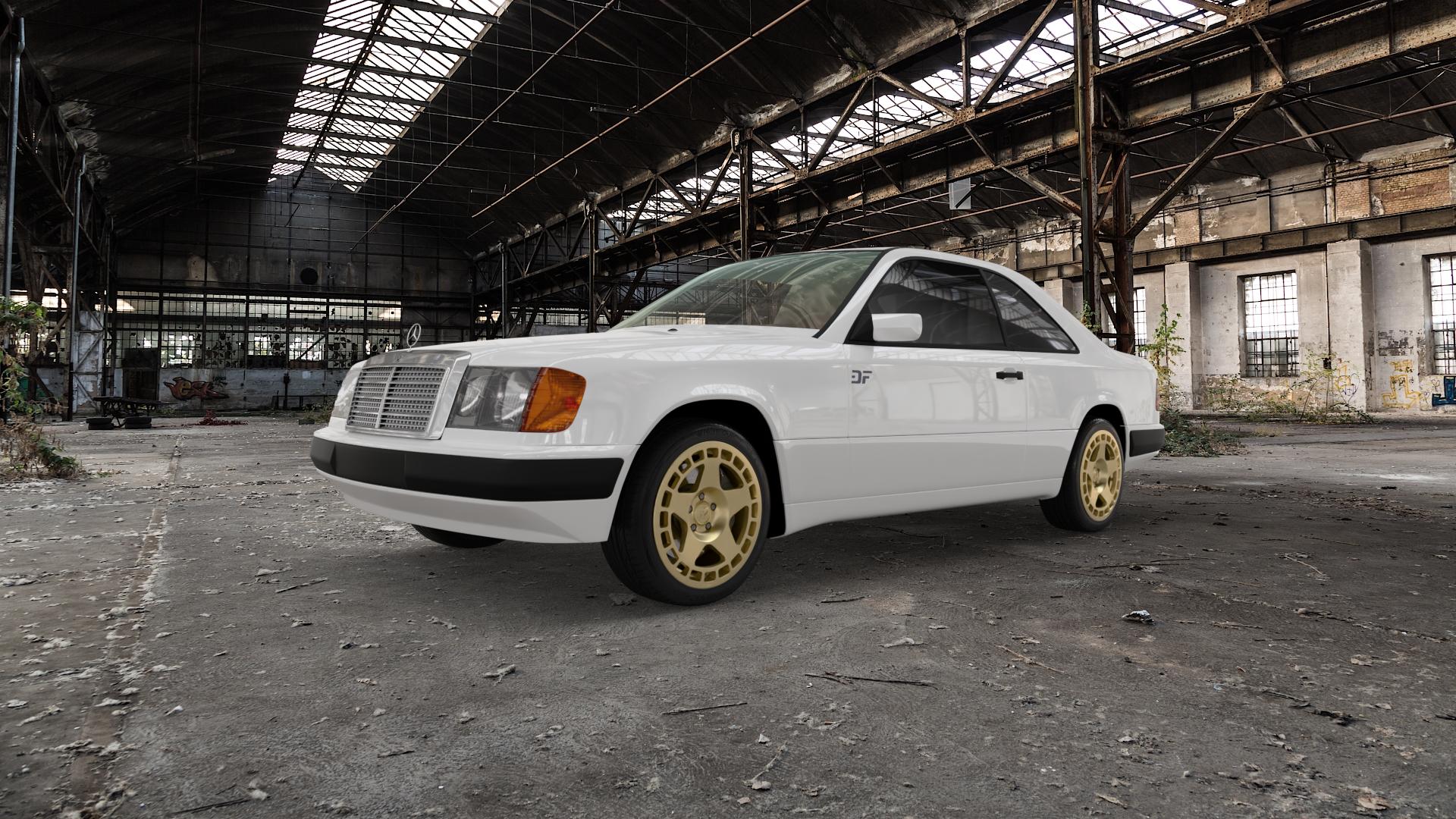 fifteen52 Turbomac Gold Felge mit Reifen in 17Zoll Winterfelge Alufelge auf weissem Mercedes E-Klasse Typ W124 Coupe ⬇️ mit 15mm Tieferlegung ⬇️ Old Industrial Hall_max5000mm_2022 Frontansicht_1