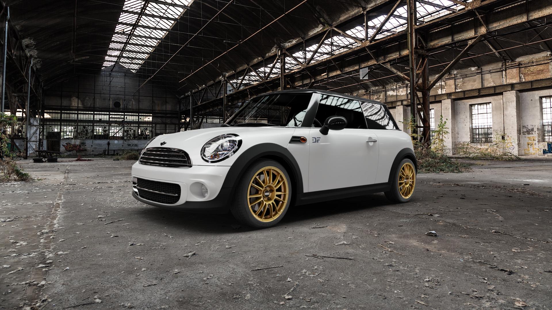 Fondmetal 9RR GLOSSY GOLD Felge mit Reifen in 17Zoll Winterfelge Alufelge auf weissem Mini R56 Typ UKL-L (Limousine) MINI-N ⬇️ mit 15mm Tieferlegung ⬇️ Old Industrial Hall_max5000mm_2022 Frontansicht_1