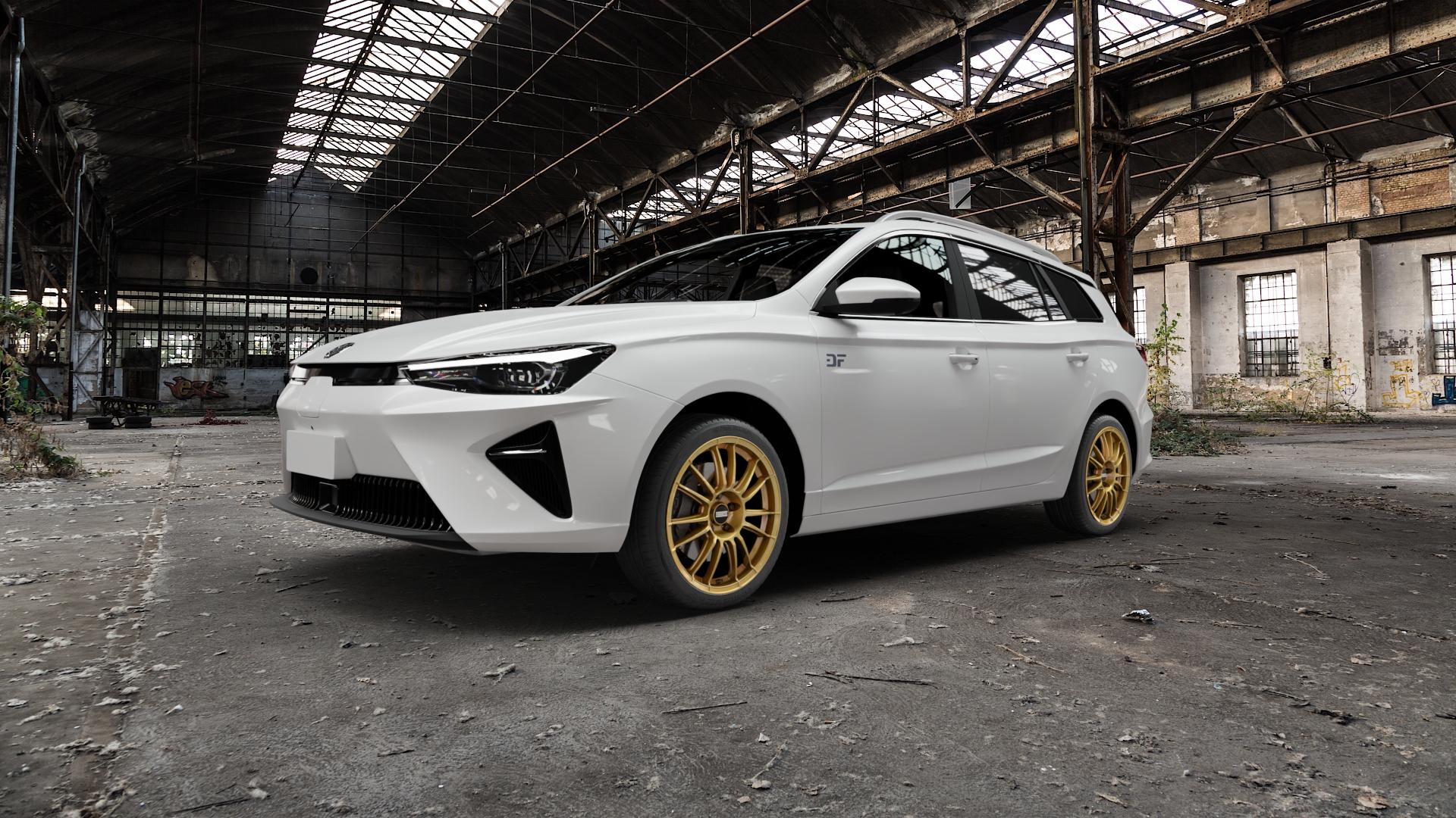 Fondmetal 9RR GLOSSY GOLD Felge mit Reifen in 18Zoll Winterfelge Alufelge auf weissem MG MG5 Typ EP22-L ⬇️ mit 15mm Tieferlegung ⬇️ Old Industrial Hall_max5000mm_2022 Frontansicht_1