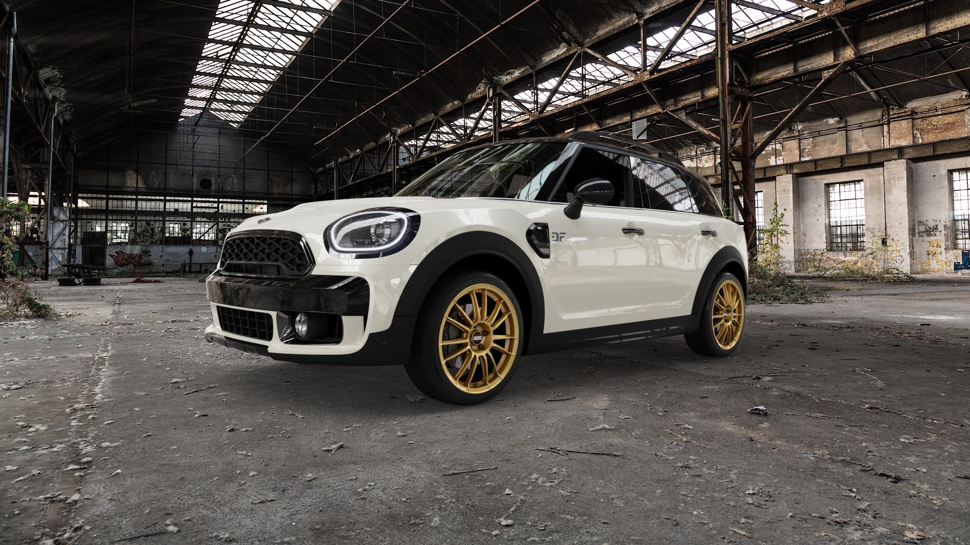 Fondmetal 9RR GLOSSY GOLD Felge mit Reifen in 19Zoll Winterfelge Alufelge auf weissem Mini F60 Typ FMX (Countryman) ⬇️ mit 15mm Tieferlegung ⬇️ Old Industrial Hall_max5000mm_2022 Frontansicht_1