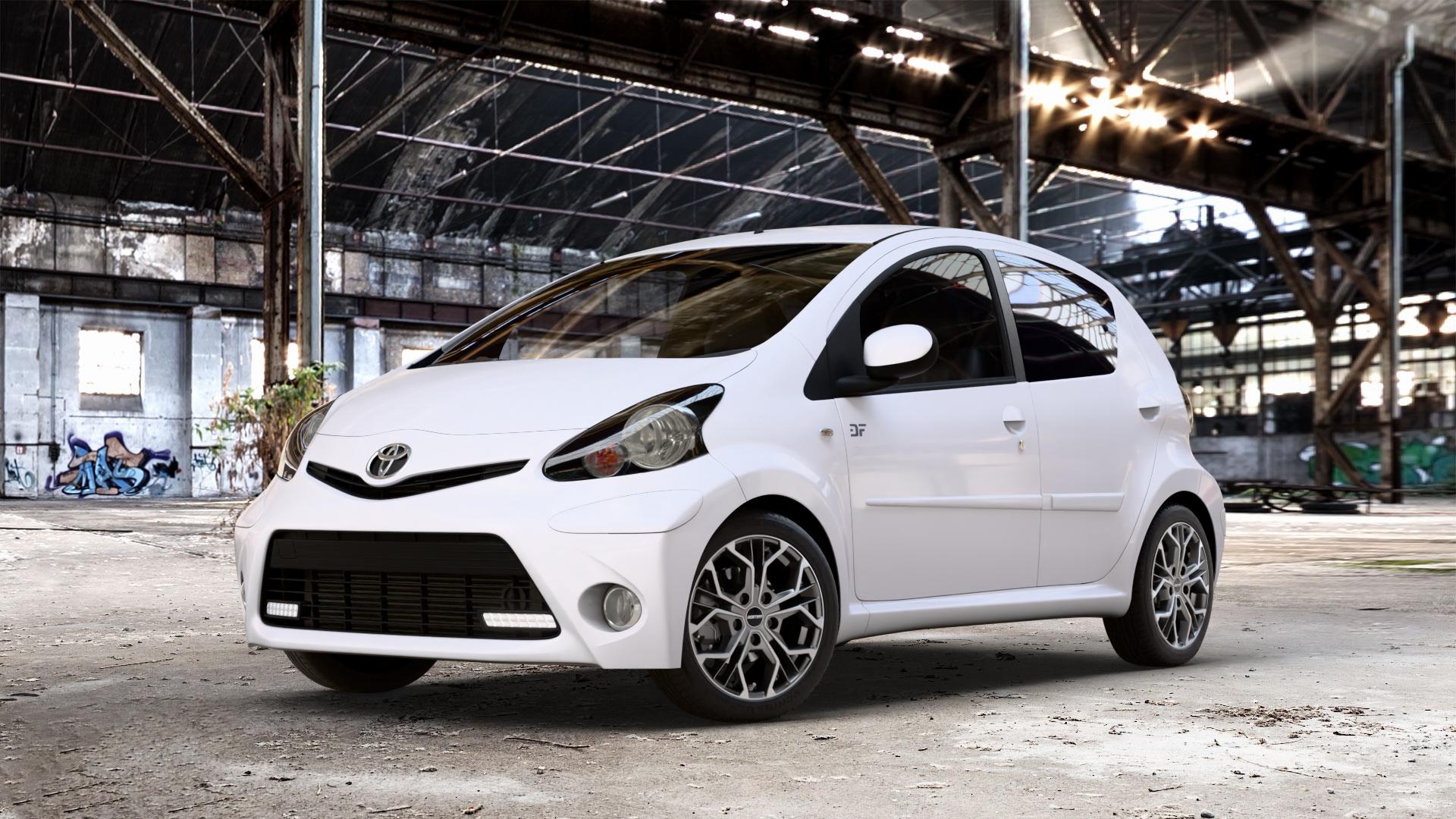 GMP Italia MATISSE Anthr. matt diamond Felge mit Reifen grau anthrazit in 15Zoll Winterfelge Alufelge auf weissem Toyota Aygo I ⬇️ mit 15mm Tieferlegung ⬇️ Old Industrial Hall_max_4400mm_2024 Frontansicht_1
