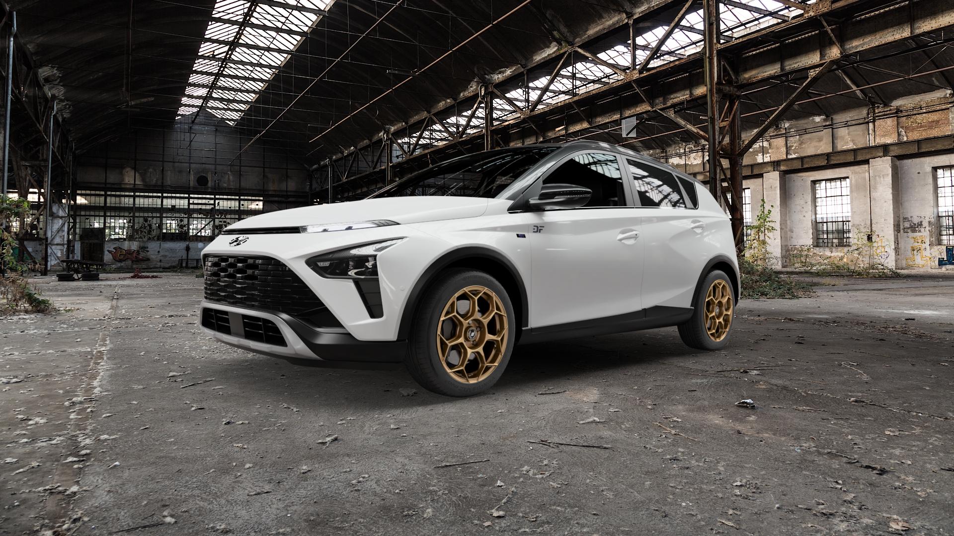 GMP Italia Raceway Oro Corsa Felge mit Reifen gold in 17Zoll Winterfelge Alufelge auf weissem Hyundai Bayon Typ BC3 ⬇️ mit 15mm Tieferlegung ⬇️ Old Industrial Hall_max5000mm_2022 Frontansicht_1