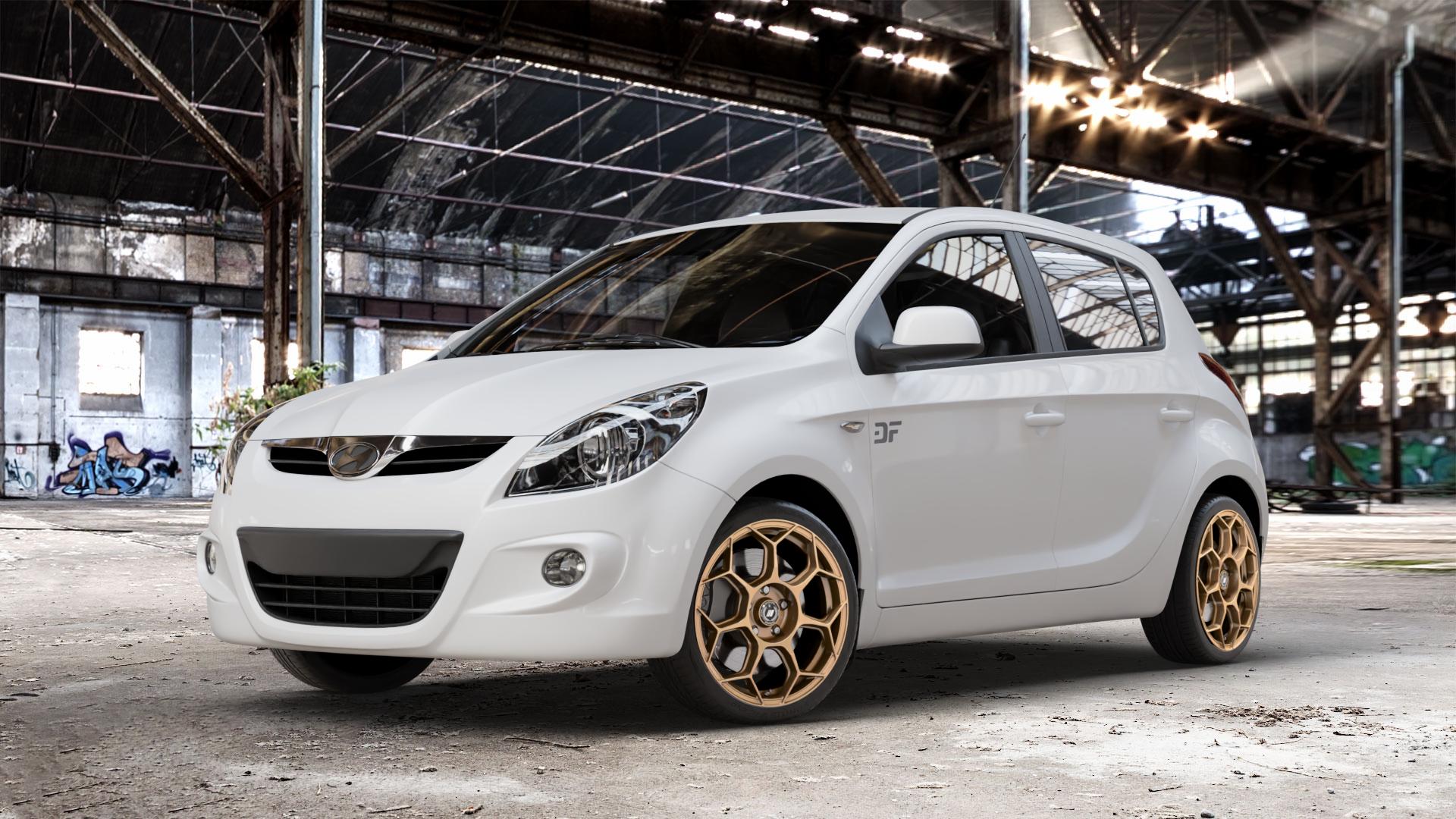GMP Italia Raceway Oro Corsa Felge mit Reifen gold in 17Zoll Winterfelge Alufelge auf weissem Hyundai i20 Typ PB, PBT (08-12) ⬇️ mit 15mm Tieferlegung ⬇️ Old Industrial Hall_max_4400mm_2024 Frontansicht_1