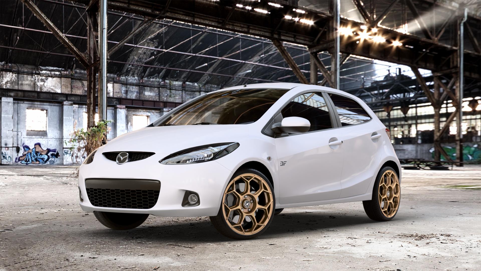 GMP Italia Raceway Oro Corsa Felge mit Reifen gold in 17Zoll Winterfelge Alufelge auf weissem Mazda 2 (07-14) (DE) 1,3l MZR 55kW (75 PS) 63kW (86 1,5l 76kW (103 1,4l MZR-CD 50kW (68 1,6l MZ-CD 66kW (90 LPG 62kW (84 70kW (95 75kW (102 ⬇️ mit 15mm Tieferlegung ⬇️ Old Industrial Hall_max_4400mm_2024 Frontansicht_1