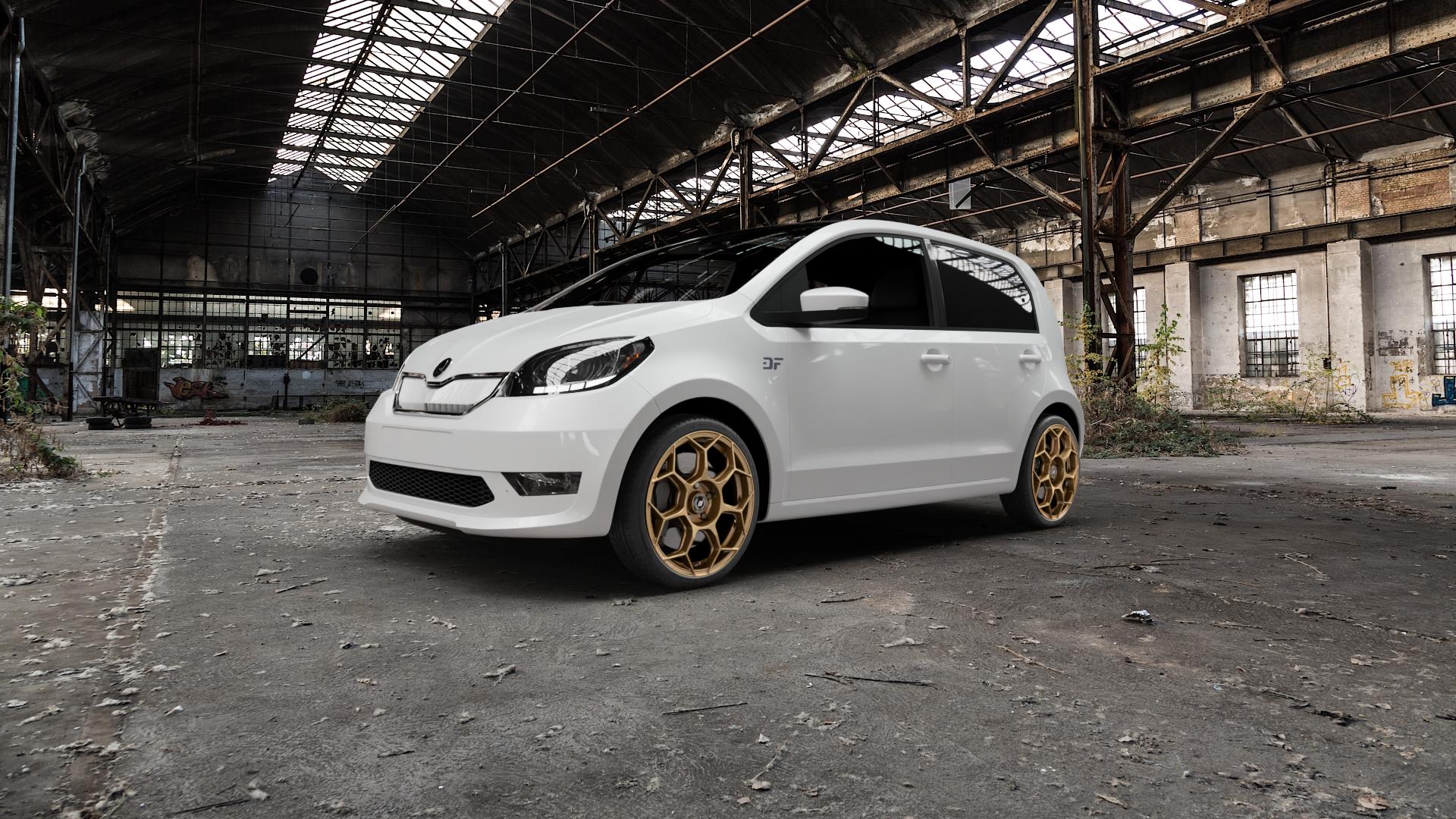 GMP Italia Raceway Oro Corsa Felge mit Reifen gold in 17Zoll Winterfelge Alufelge auf weissem Skoda Citigo-e iV Typ AA ⬇️ mit 15mm Tieferlegung ⬇️ Old Industrial Hall_max5000mm_2022 Frontansicht_1