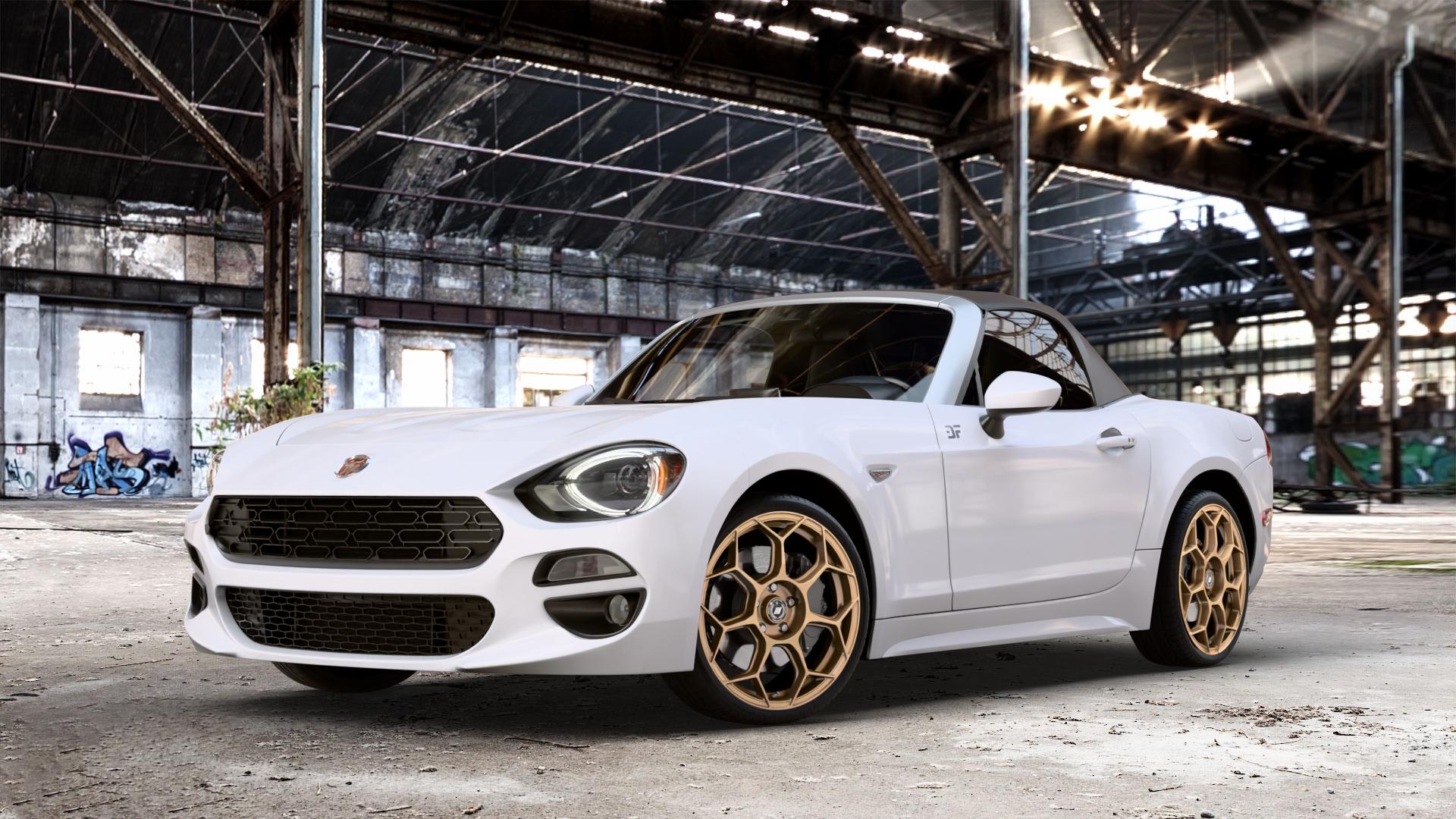 GMP Italia Raceway Oro Corsa Felge mit Reifen gold in 18Zoll Winterfelge Alufelge auf weissem Fiat 124 Spider Typ NF ⬇️ mit 15mm Tieferlegung ⬇️ Old Industrial Hall_max_4400mm_2024 Frontansicht_1
