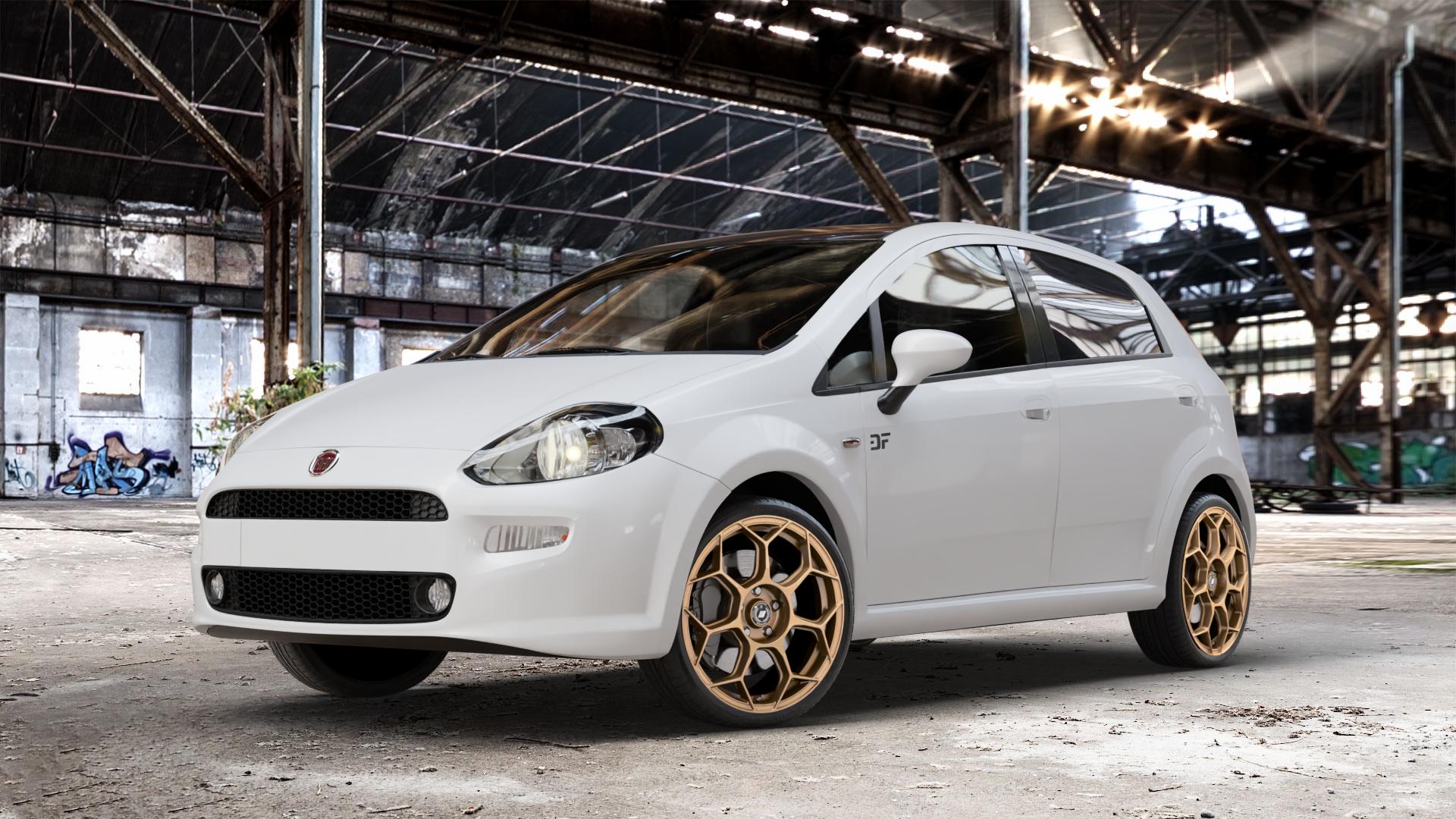 GMP Italia Raceway Oro Corsa Felge mit Reifen gold in 18Zoll Winterfelge Alufelge auf weissem Fiat Punto / Grande Typ 199 (12->) ⬇️ mit 15mm Tieferlegung ⬇️ Old Industrial Hall_max_4400mm_2024 Frontansicht_1