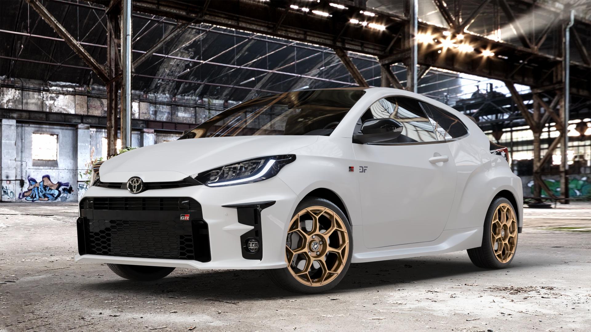 GMP Italia Raceway Oro Corsa Felge mit Reifen gold in 18Zoll Winterfelge Alufelge auf weissem Toyota Yaris IV Typ XPA1F(EU,M) l kW (0 PS) GR XPA1G(EU,M) ⬇️ mit 15mm Tieferlegung ⬇️ Old Industrial Hall_max_4400mm_2024 Frontansicht_1