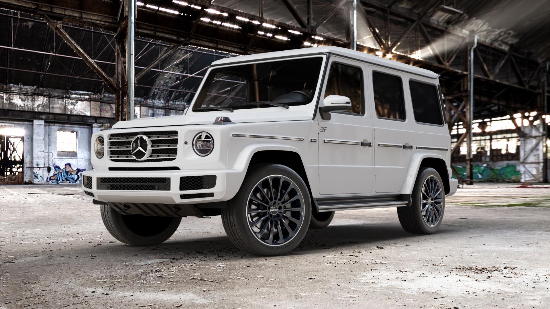 GMP Italia Stellar Black diamond lip Felge mit Reifen schwarz in 21Zoll Winterfelge Alufelge auf weissem Mercedes G-Klasse Typ W463 Facelift (18->) ⬇️ mit 15mm Tieferlegung ⬇️ Old Industrial Hall_max_5300mm_2024 Frontansicht_1