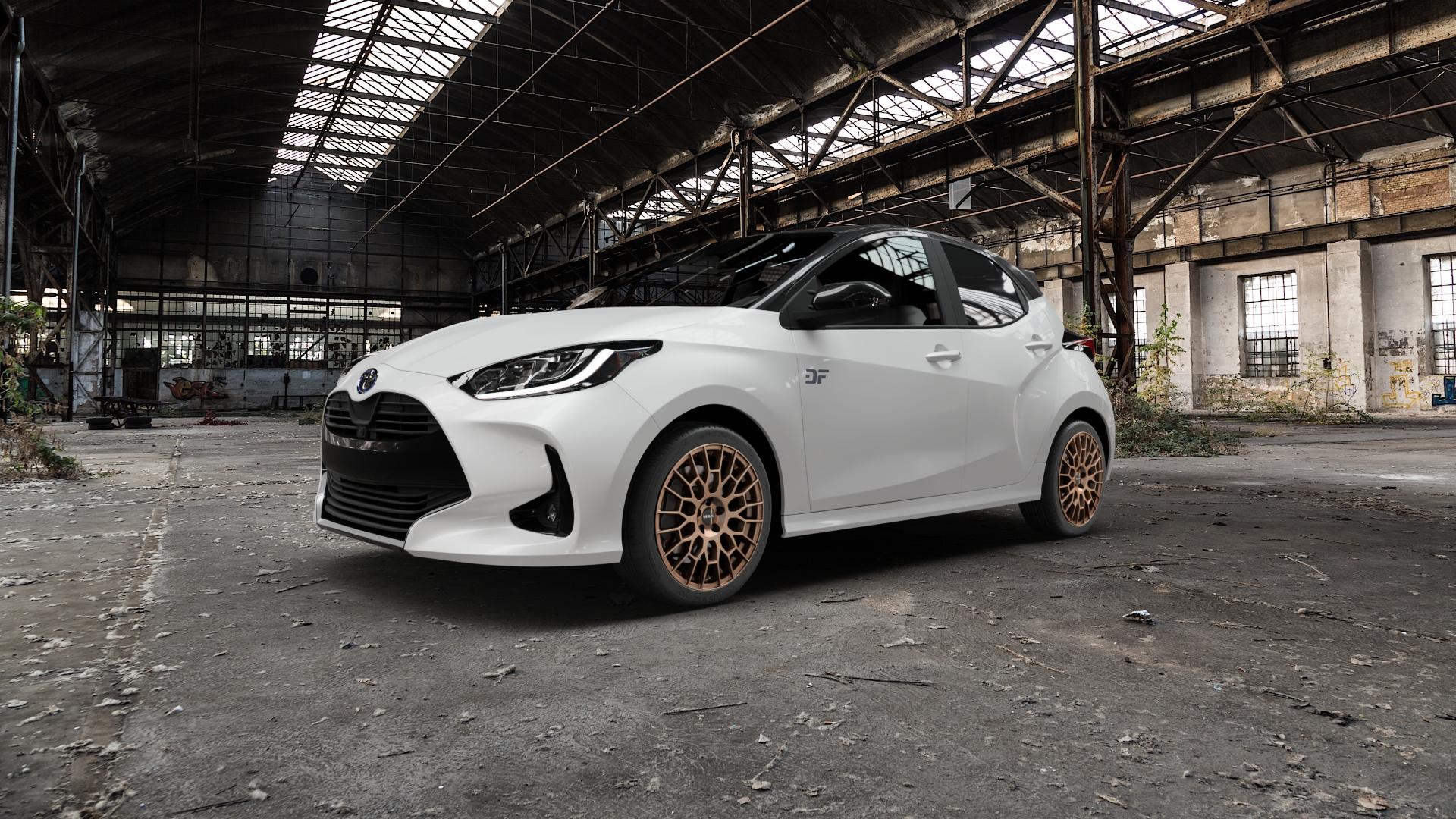 MAK APX Matt Bronze Felge mit Reifen in 17Zoll Alufelge auf weissem Toyota Yaris IV Typ XPA1F(EU,M) XPA1F(EUM)-TGRE ⬇️ mit 15mm Tieferlegung ⬇️ Old Industrial Hall_max5000mm_2022 Frontansicht_1