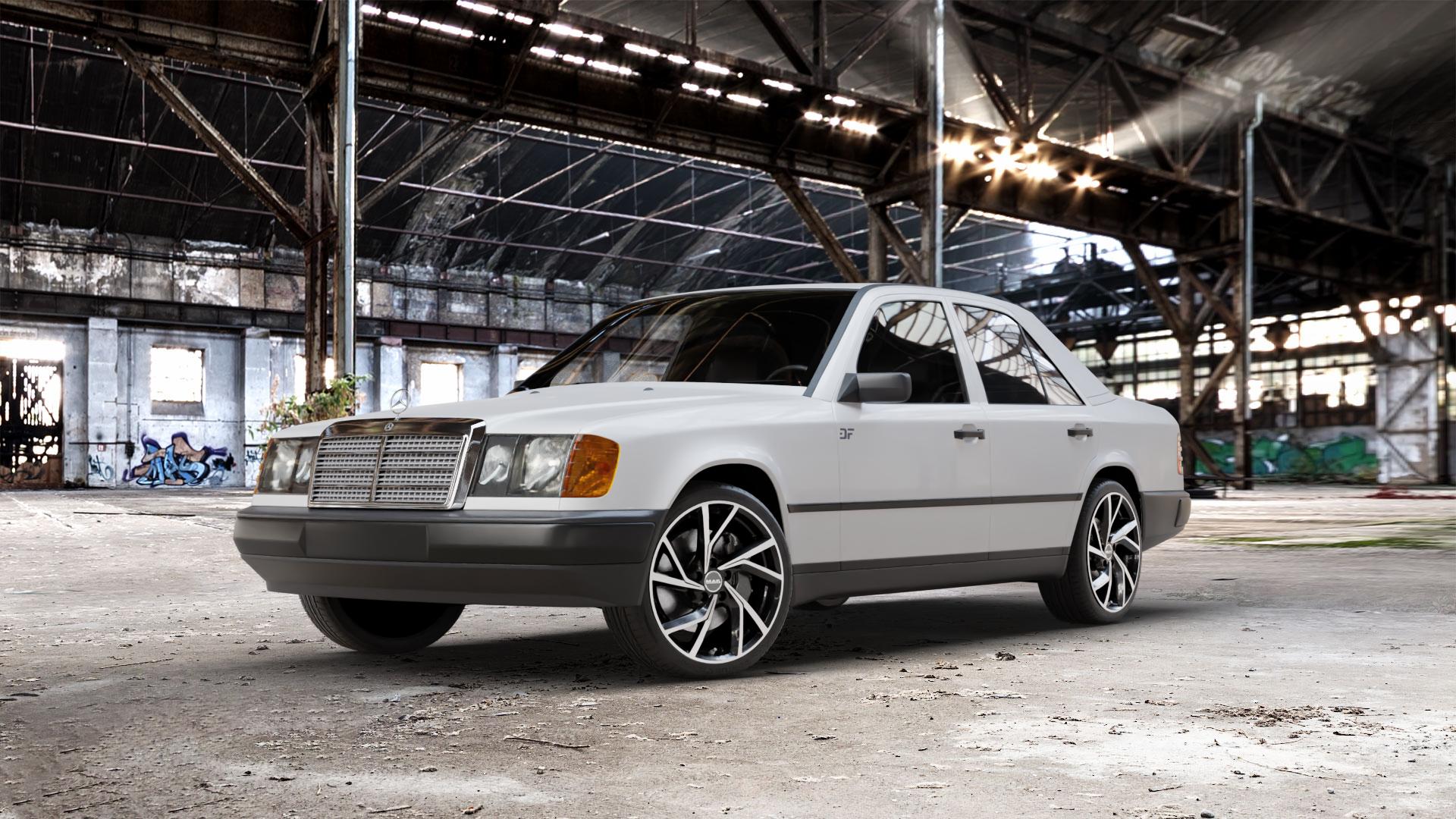 MAK Kassel Black Mirror Felge mit Reifen silber schwarz mehrfarbig in 18Zoll Alufelge auf weissem Mercedes E-Klasse Typ W124 Limousine ⬇️ mit 15mm Tieferlegung ⬇️ Old Industrial Hall_max_5300mm_2024 Frontansicht_1