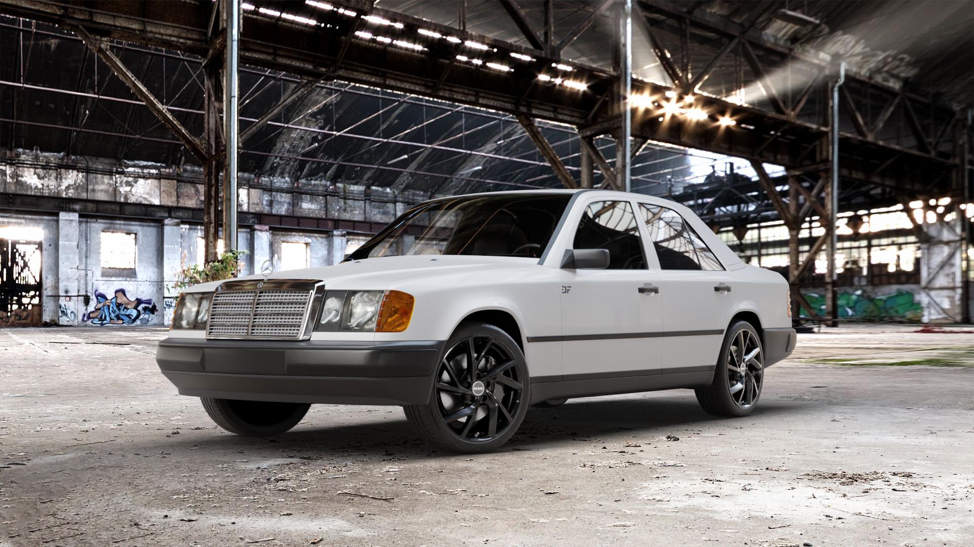 MAK Kassel Gloss Black Felge mit Reifen schwarz in 18Zoll Winterfelge Alufelge auf weissem Mercedes E-Klasse Typ W124 Limousine ⬇️ mit 15mm Tieferlegung ⬇️ Old Industrial Hall_max_5300mm_2024 Frontansicht_1