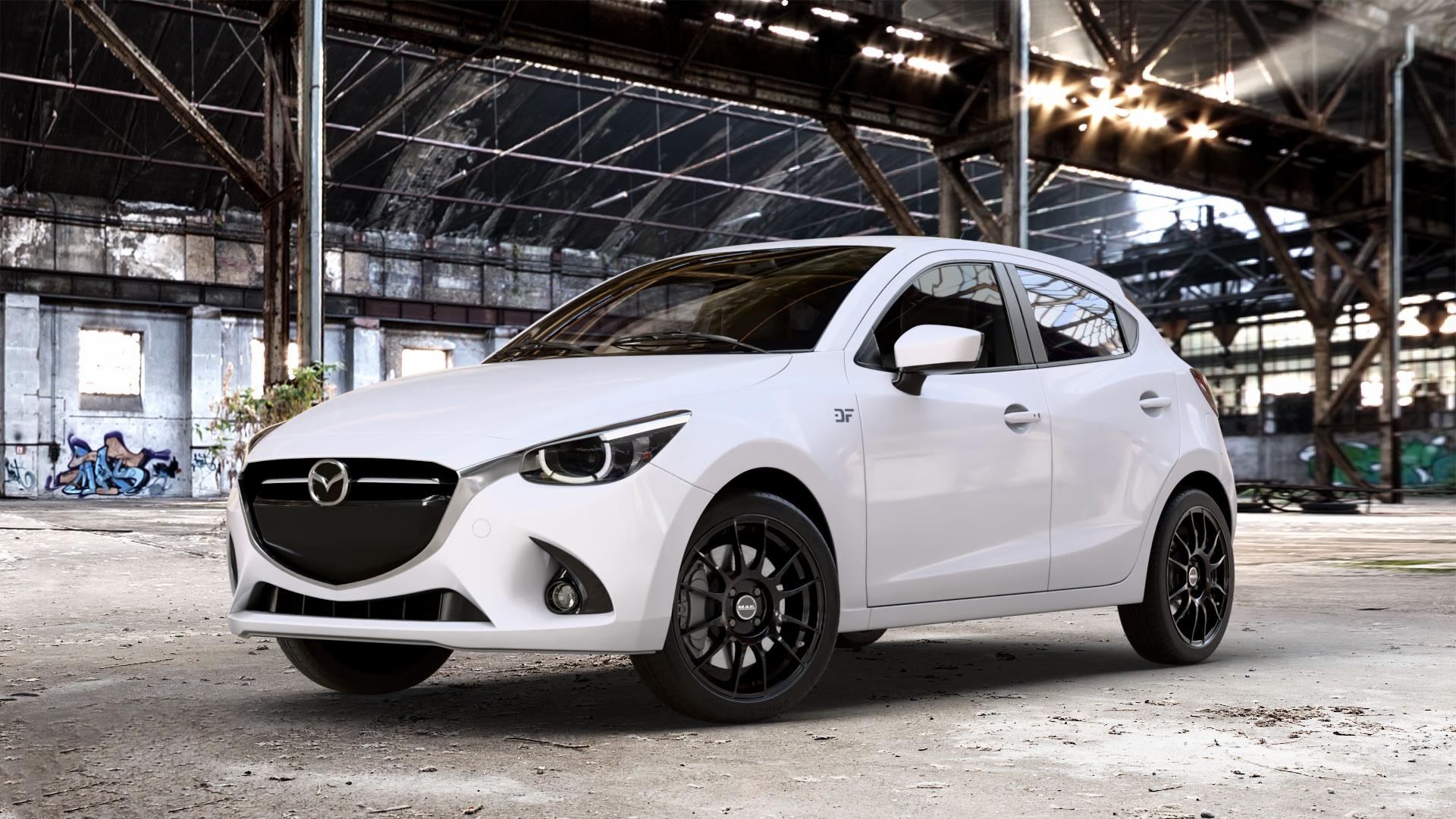 MAK XLR Gloss Black Felge mit Reifen schwarz in 17Zoll Winterfelge Alufelge auf weissem Mazda 2 (15-) (DJ) 1,5l SKYACTIV-G 75 55kW (75 PS) 90 66kW (90 115 85kW (116 SKYACTIV-D 105 77kW (105 (20-) Facelift ⬇️ mit 15mm Tieferlegung ⬇️ Old Industrial Hall_max_4400mm_2024 Frontansicht_1
