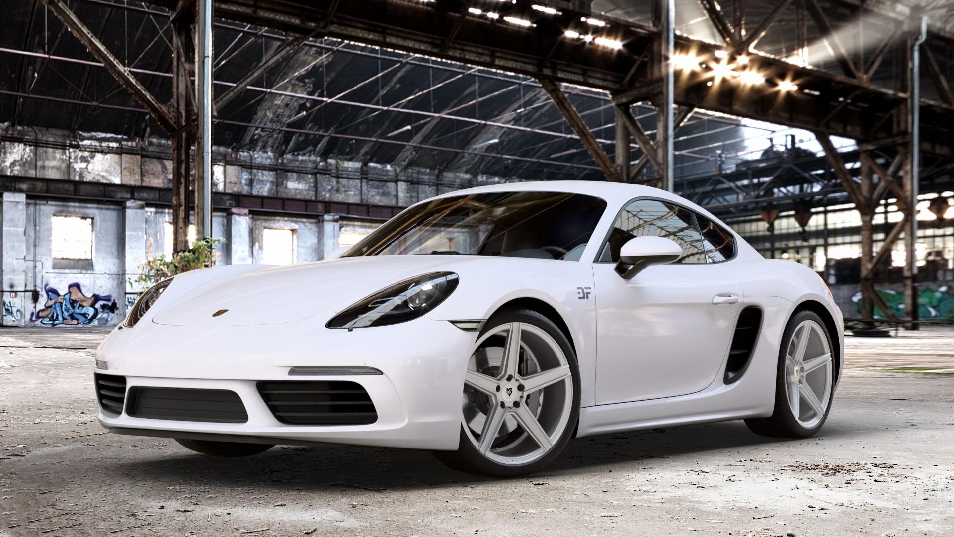 MB-DESIGN KV1 Silber Felge mit Reifen in 20Zoll Winterfelge Alufelge auf weissem Porsche 718 Cayman Typ 982 ⬇️ mit 15mm Tieferlegung ⬇️ Old Industrial Hall_max_4400mm_2024 Frontansicht_1
