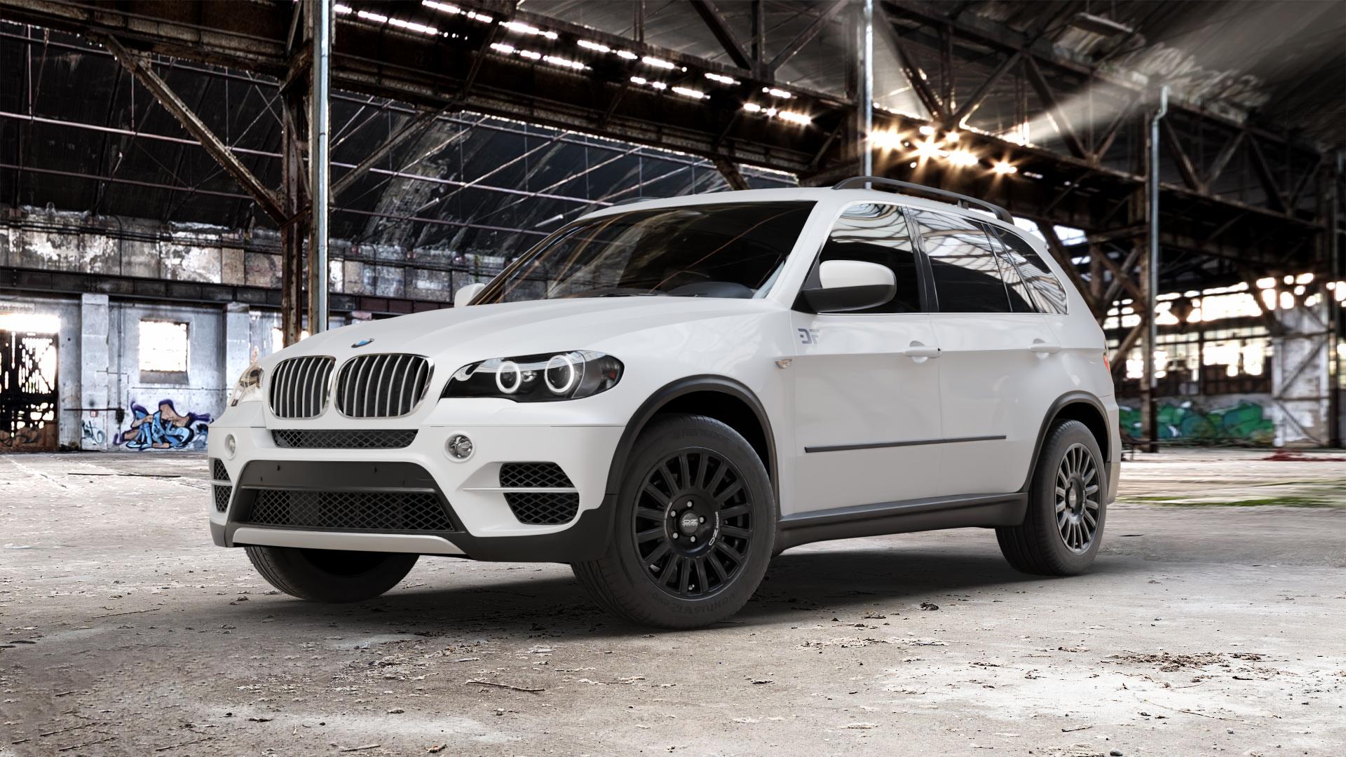 OZ RACING RALLY RAID MATT BLACK + SILVER LETTERING Felge mit Reifen silber schwarz schwarz matt in 18Zoll Winterfelge Alufelge auf weissem BMW X5 Typ E70 (X70, X5, X-N1) ⬇️ mit 15mm Tieferlegung ⬇️ Old Industrial Hall_max_5300mm_2024 Frontansicht_1