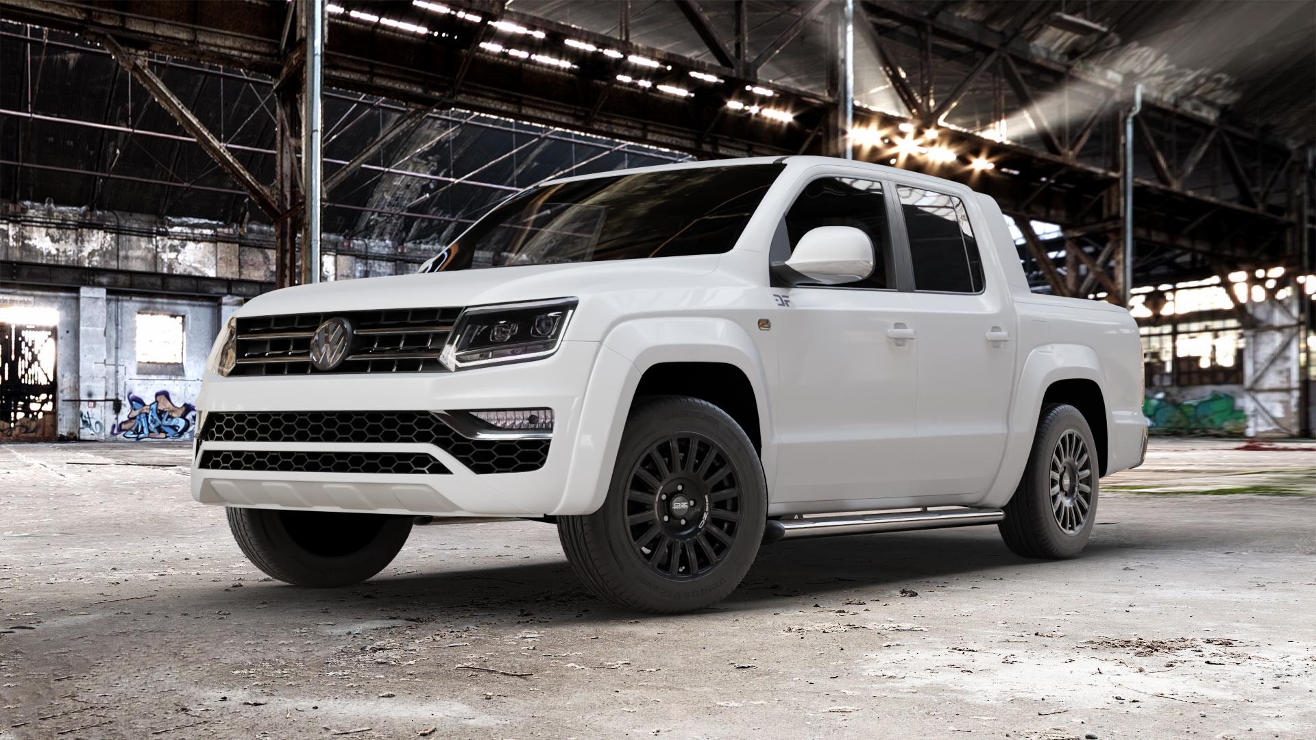 OZ RACING RALLY RAID MATT BLACK + SILVER LETTERING Felge mit Reifen silber schwarz schwarz matt in 18Zoll Winterfelge Alufelge auf weissem Volkswagen (VW) Amarok I Typ 2H Facelift ⬇️ mit 15mm Tieferlegung ⬇️ Old Industrial Hall_max_5300mm_2024 Frontansicht_1