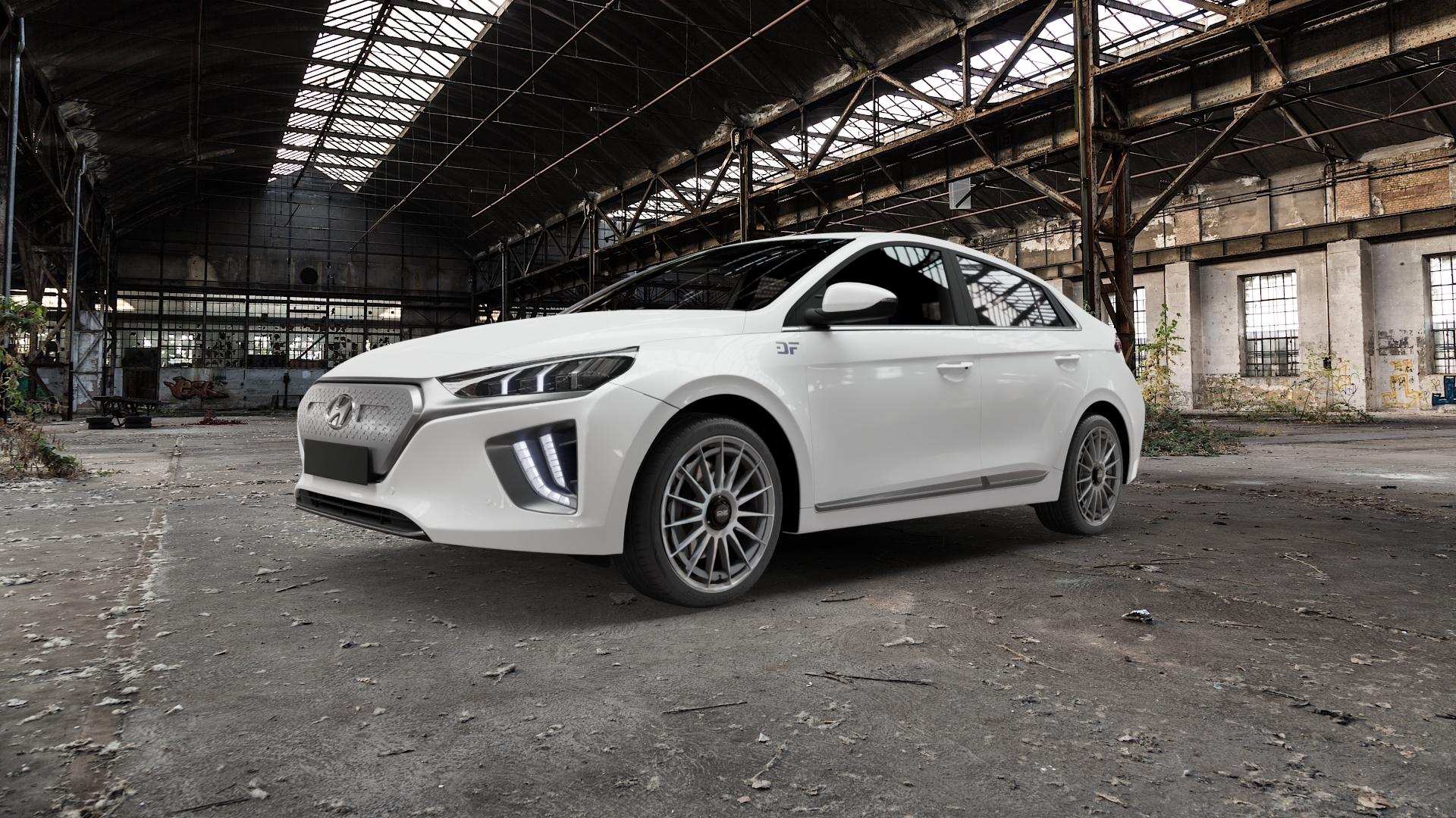 OZ RACING SUPERTURISMO AERO STAR GRAPHITE Felge mit Reifen grau anthrazit grau/silber in 18Zoll Winterfelge Alufelge auf weissem Hyundai Ioniq Typ AE Facelift ⬇️ mit 15mm Tieferlegung ⬇️ Old Industrial Hall_max5000mm_2022 Frontansicht_1