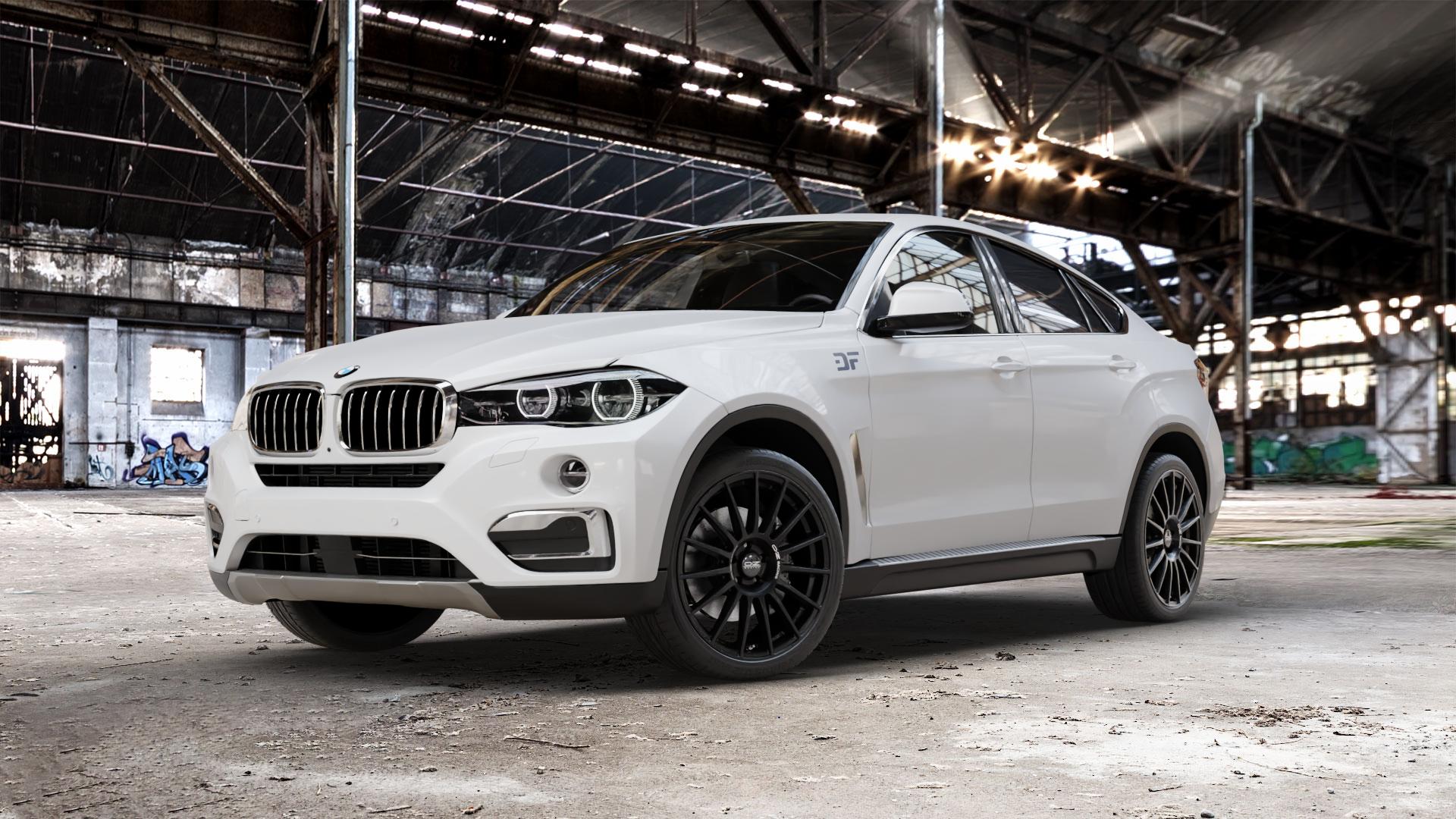 OZ RACING SUPERTURISMO DAKAR MATT BLACK + SILVER LETTERING Felge mit Reifen silber schwarz schwarz matt in 21Zoll Winterfelge Alufelge auf weissem BMW X6 Typ F16 (X6, X-N1) ⬇️ mit 15mm Tieferlegung ⬇️ Old Industrial Hall_max_5300mm_2024 Frontansicht_1