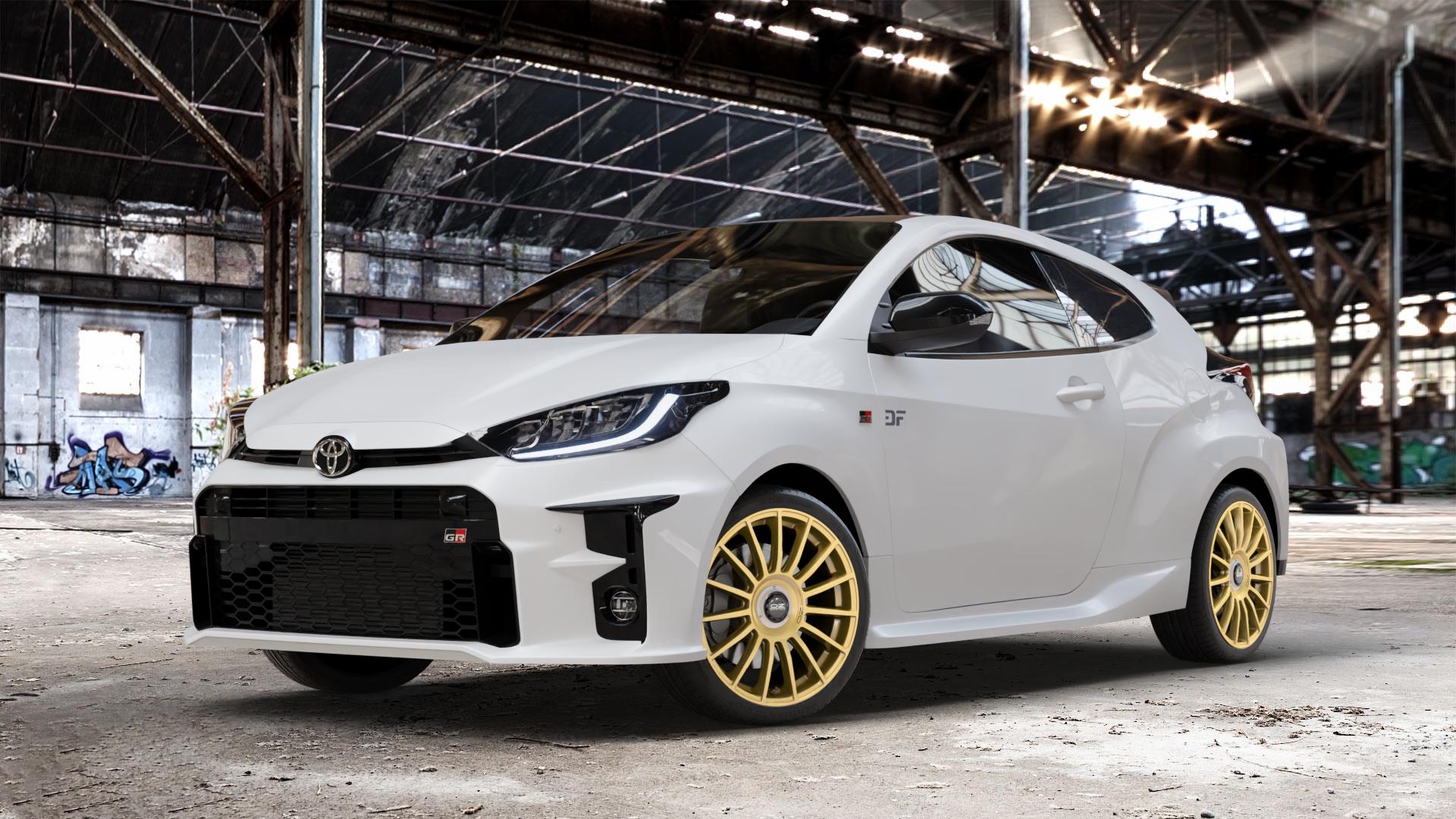 OZ RACING SUPERTURISMO EVOLUZIONE RACE GOLD + BLACK LETTERING Felge mit Reifen in 18Zoll Winterfelge Alufelge auf weissem Toyota Yaris IV Typ XPA1F(EU,M) l kW (0 PS) GR XPA1G(EU,M) ⬇️ mit 15mm Tieferlegung ⬇️ Old Industrial Hall_max_4400mm_2024 Frontansicht_1