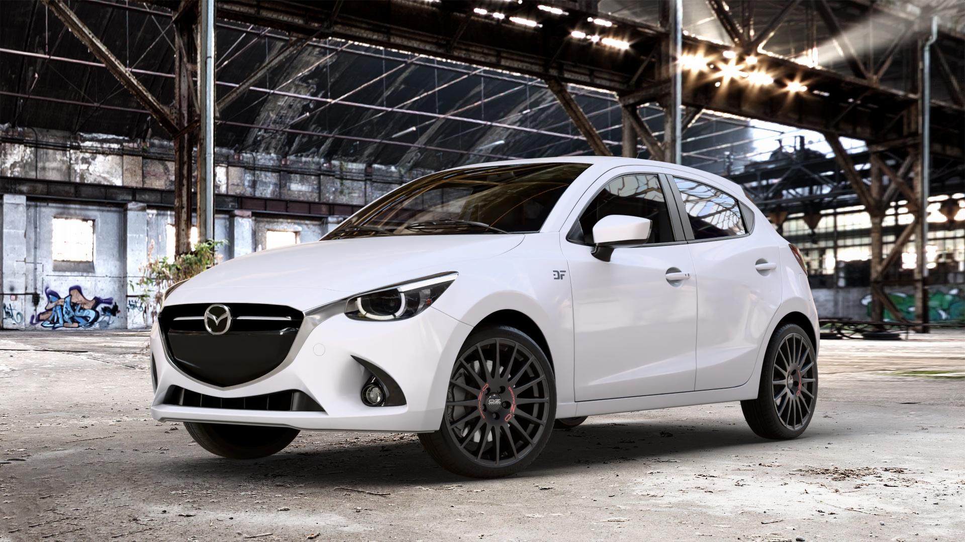 OZ RACING SUPERTURISMO GT MATT BLACK Felge mit Reifen schwarz schwarz matt in 18Zoll Winterfelge Alufelge auf weissem Mazda 2 (15-) (DJ) 1,5l SKYACTIV-G 75 55kW (75 PS) 90 66kW (90 115 85kW (116 SKYACTIV-D 105 77kW (105 (20-) Facelift ⬇️ mit 15mm Tieferlegung ⬇️ Old Industrial Hall_max_4400mm_2024 Frontansicht_1