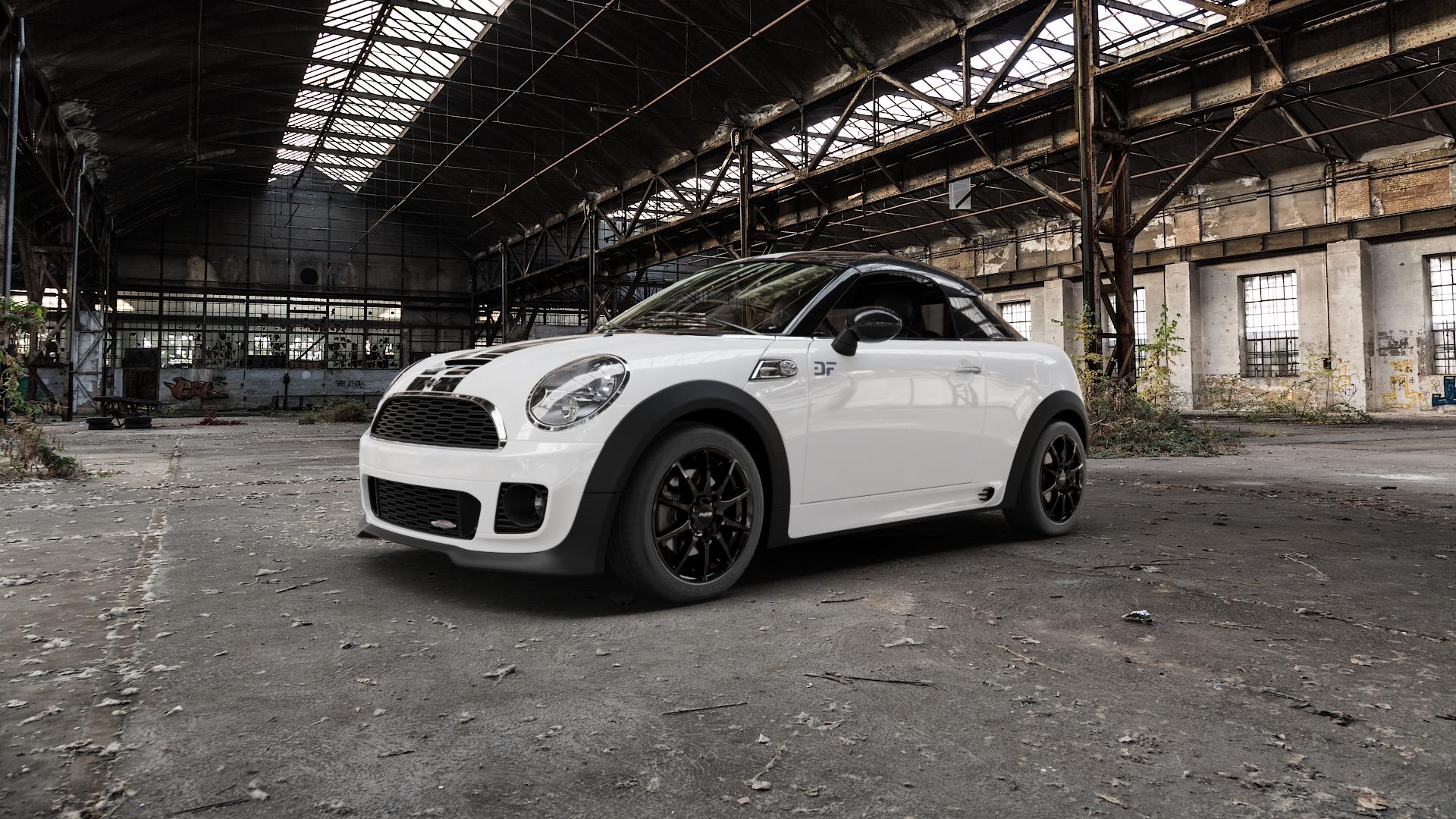 Platin Wheels P 113 black painted Felge mit Reifen schwarz in 16Zoll Winterfelge Alufelge auf weissem Mini R58 Typ UKL-C (Coupe) 1,6l Cooper 90kW (122 PS) S 135kW (184 2,0l SD 105kW (143 JCW 155kW (211 ⬇️ mit 15mm Tieferlegung ⬇️ Old Industrial Hall_max5000mm_2022 Frontansicht_1