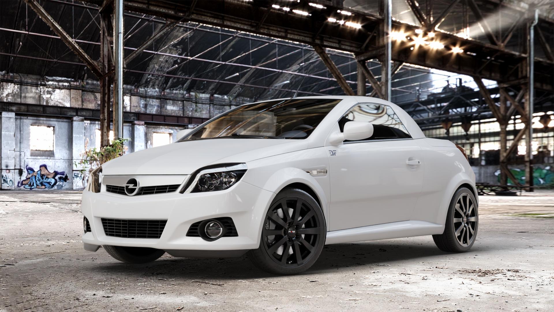 Platin Wheels P 58 matt black Felge mit Reifen schwarz schwarz matt in 17Zoll Winterfelge Alufelge auf weissem Opel Tigra B TwinTop ⬇️ mit 15mm Tieferlegung ⬇️ Old Industrial Hall_max_4400mm_2024 Frontansicht_1