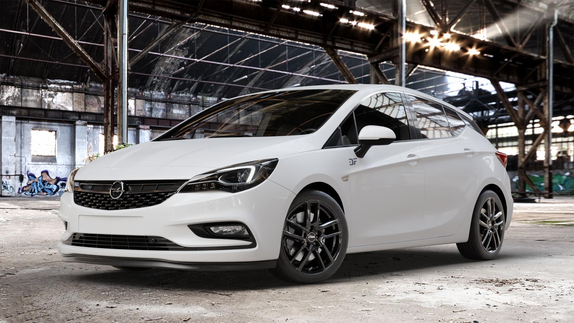 RIAL Astorga diamant-schwarz Felge mit Reifen in 17Zoll Winterfelge Alufelge auf weissem Opel Astra K Typ B-K ⬇️ mit 15mm Tieferlegung ⬇️ Old Industrial Hall_max_4400mm_2024 Frontansicht_1