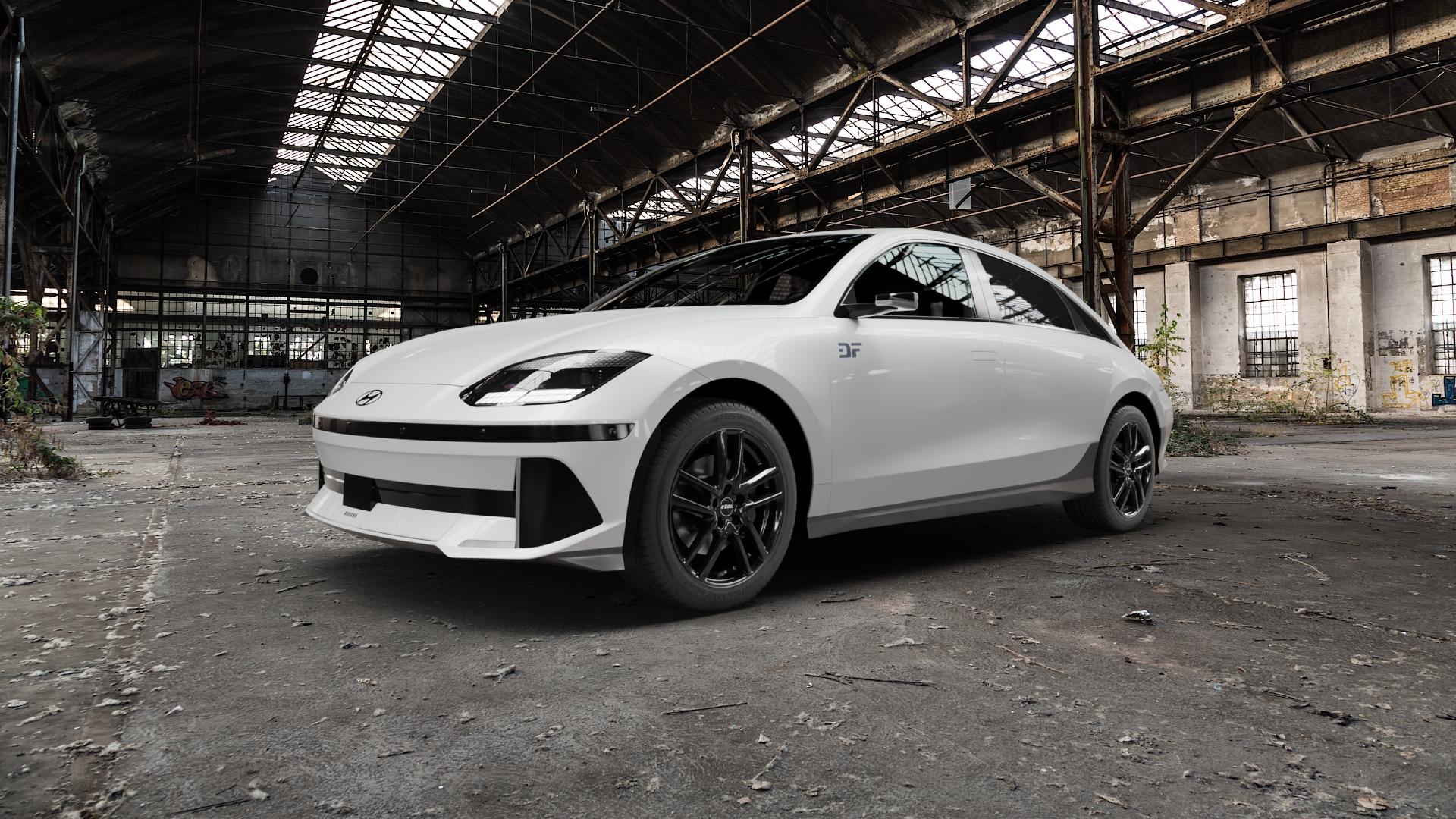 RIAL Astorga diamant-schwarz Felge mit Reifen in 18Zoll Winterfelge Alufelge auf weissem Hyundai Ioniq 6 Typ CE ⬇️ mit 15mm Tieferlegung ⬇️ Old Industrial Hall_max5000mm_2022 Frontansicht_1