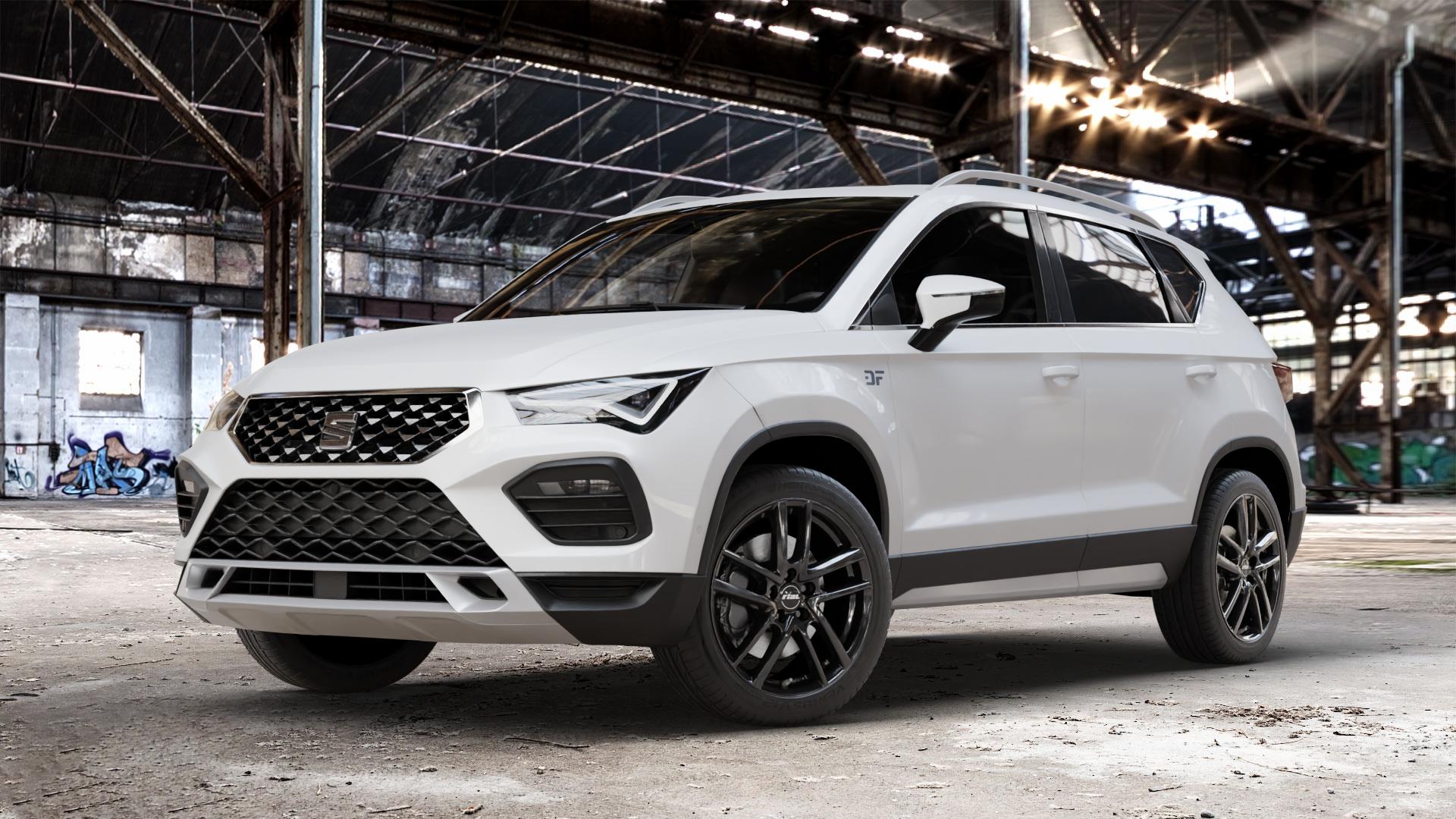 RIAL Astorga diamant-schwarz Felge mit Reifen in 18Zoll Winterfelge Alufelge auf weissem Seat Ateca Typ 5FP Facelift ⬇️ mit 15mm Tieferlegung ⬇️ Old Industrial Hall_max_4400mm_2024 Frontansicht_1