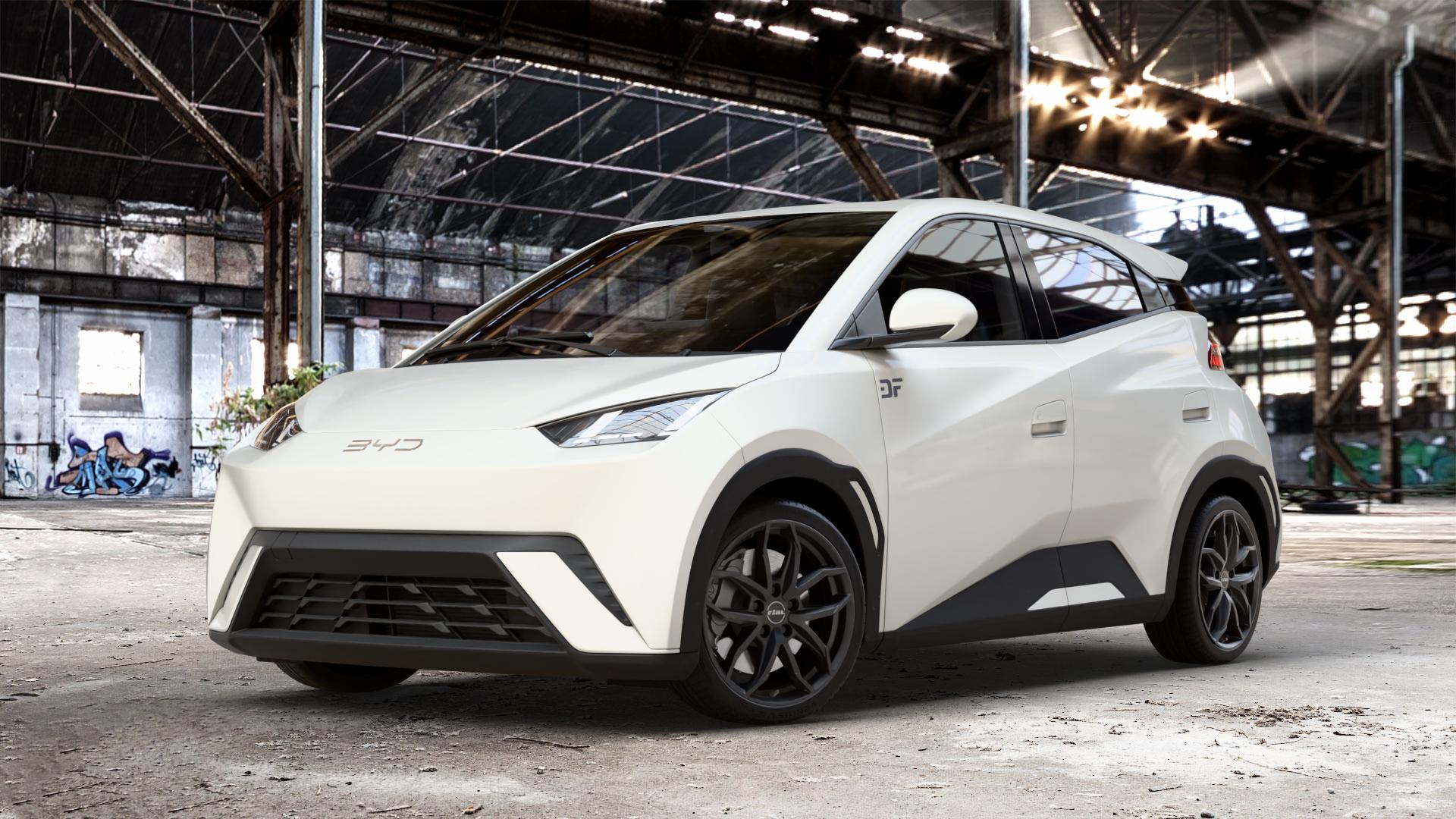 RIAL Lucca diamant-schwarz Felge mit Reifen in 17Zoll Winterfelge Alufelge auf weissem BYD Dolphin Surf Typ EQE 0,0l 35kW EV300 (48 PS) 60kW EV400 (82 ⬇️ mit 15mm Tieferlegung ⬇️ Old Industrial Hall_max_4400mm_2024 Frontansicht_1
